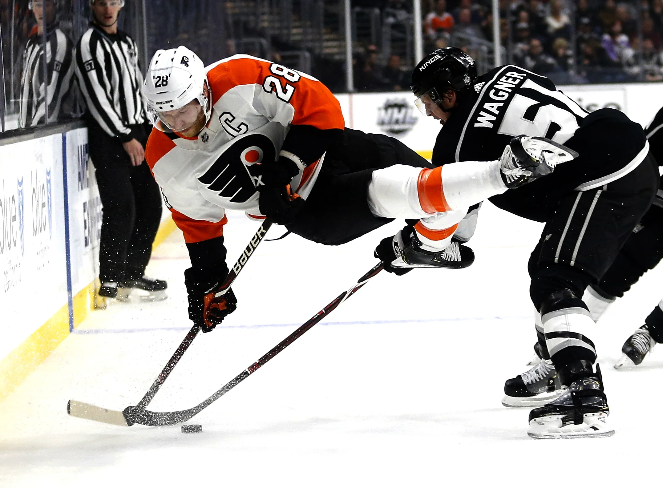  Philadelphia Flyers forward Claude Giroux (28) and Los Angeles Kings forward Austin Wagner (51) vie for the puck during the second period of an NHL hockey game Thursday, Nov. 1, 2018, in Los Angeles.  