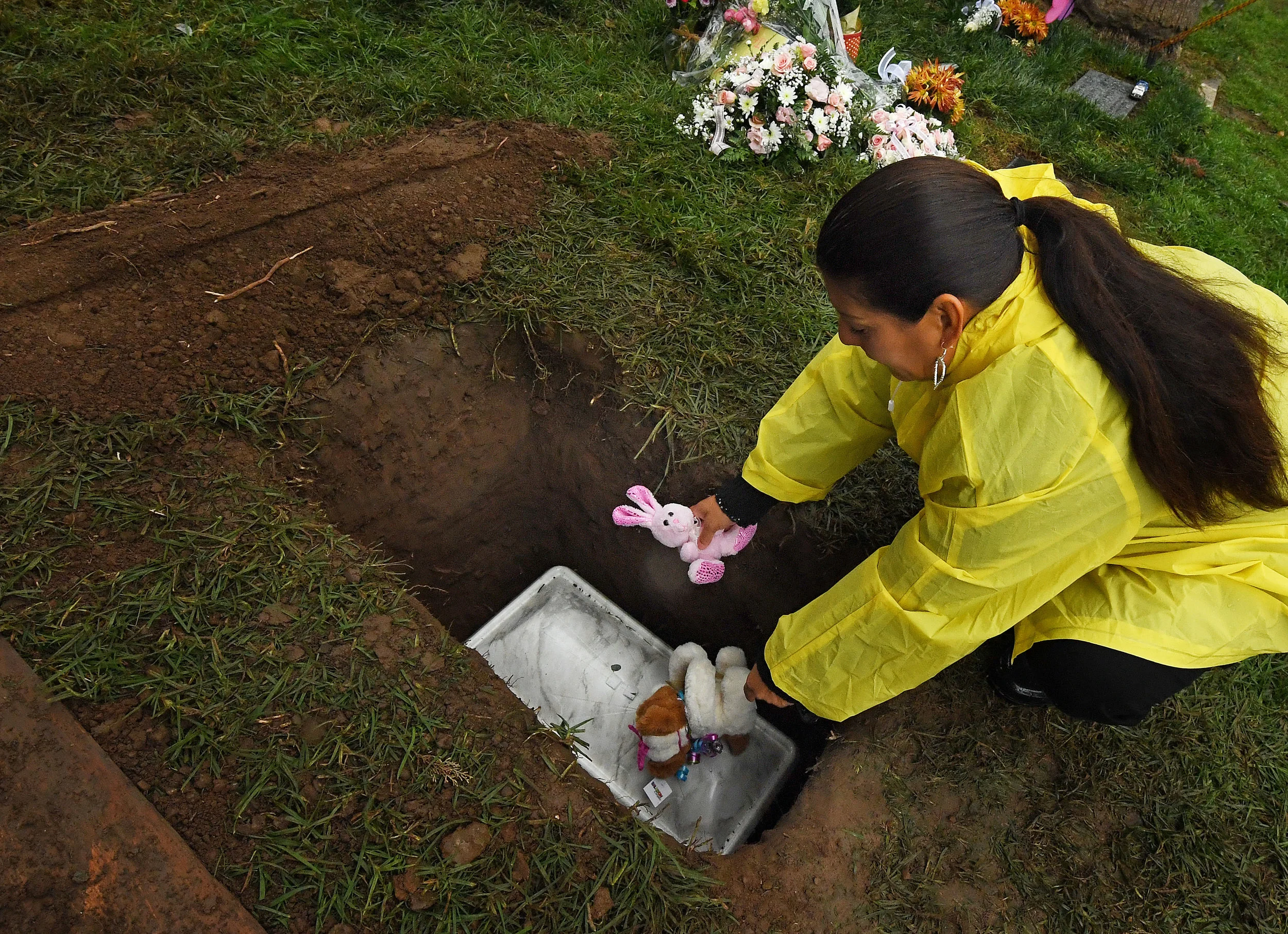  Monica Montejano, from Corona, places stuffed animals atop the grave of Baby Jane Doe at Sunnyslope Cemetery in Corona, Thursday, December 6, 2018. The newborn infant was found in a cardboard box near the 15 freeway in Corona in July. Corona police 