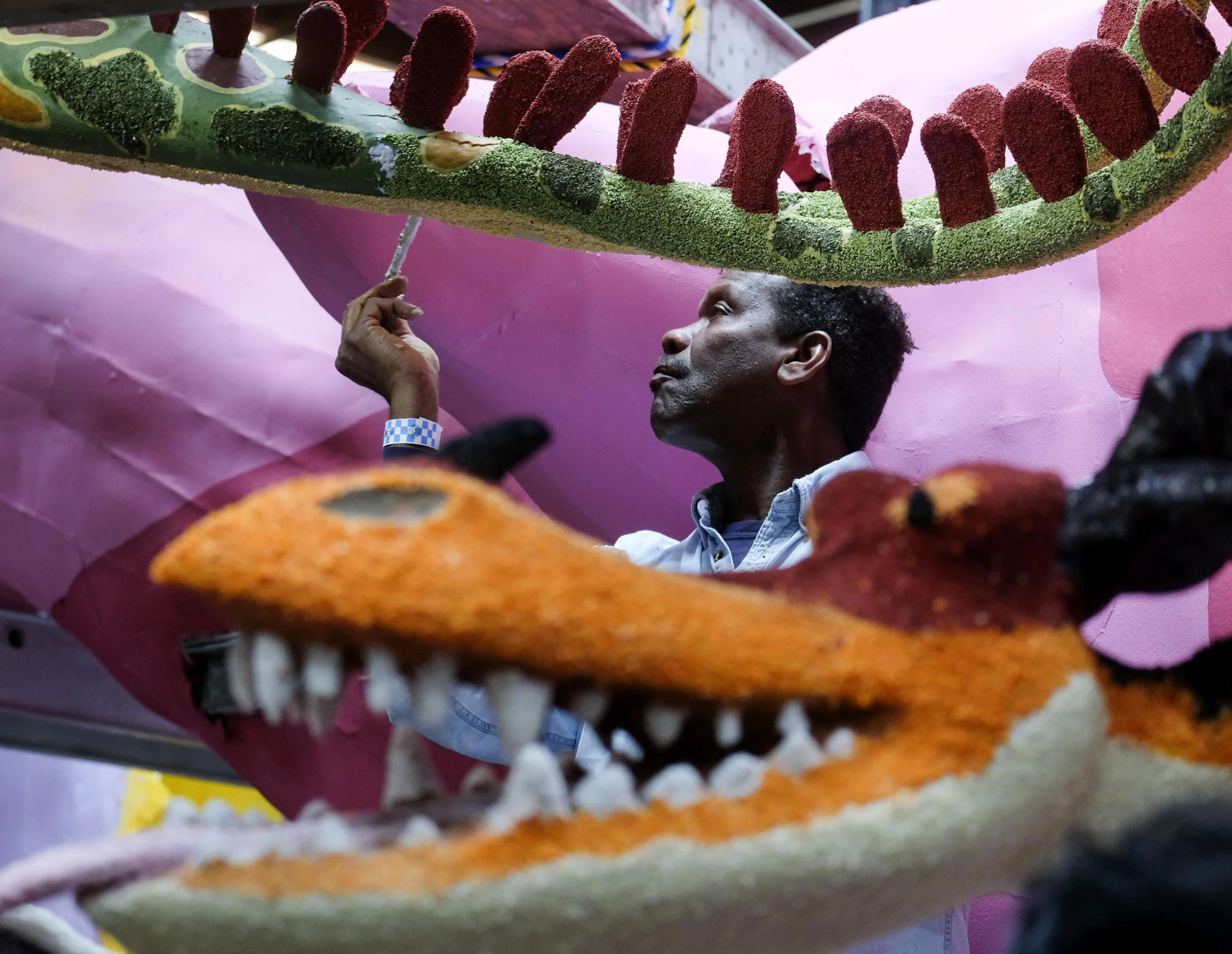  A volunteers works on a flower float for the 130th Rose Parade in Pasadena on Dec. 29, 2018. Better known as the Rose Parade, the festival of flower-covered floats will take place on New Year's Day, Jan. 1, 2019. 
 