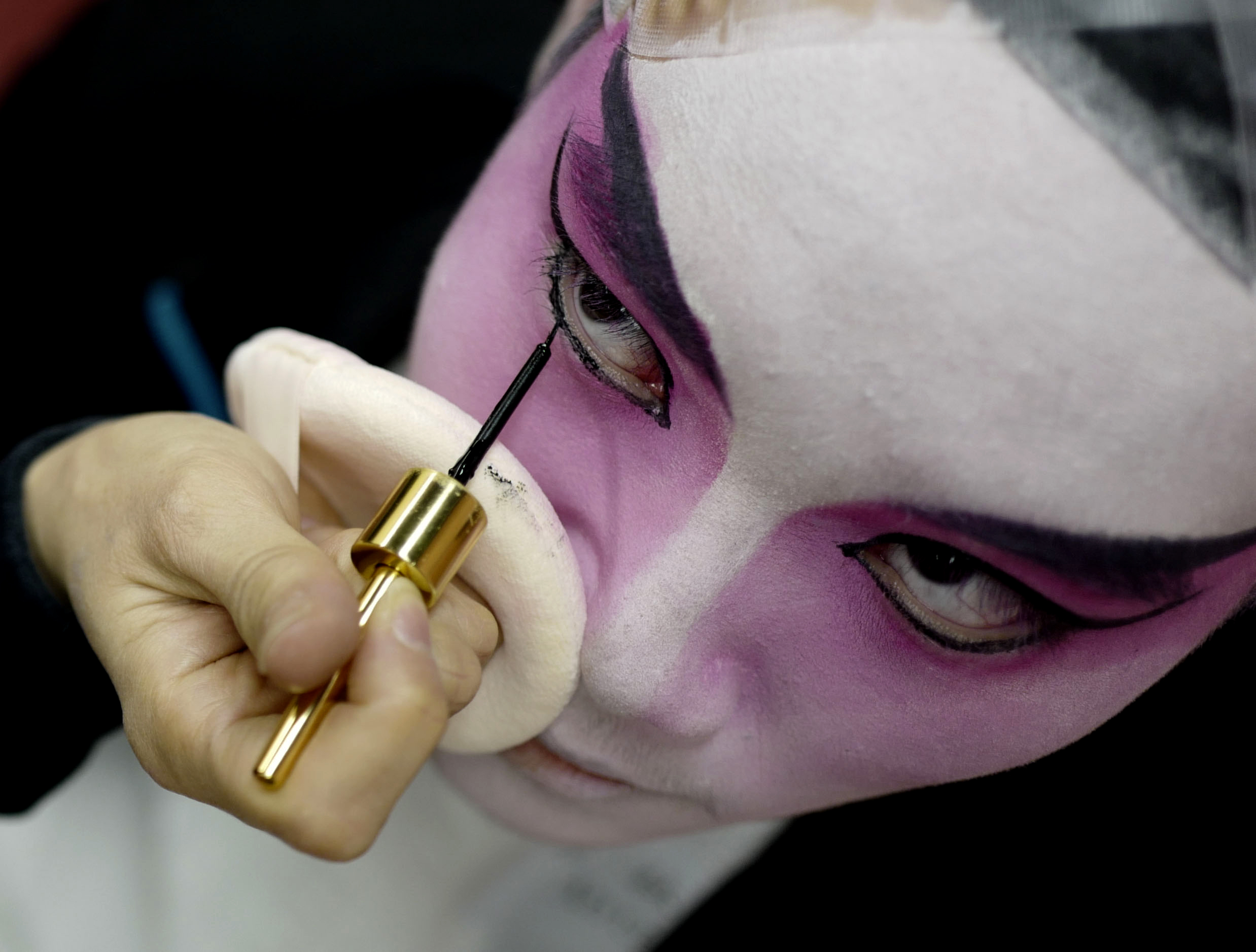  A young opera artist is applied a makeup before a performance during the Children's Cantonese Opera 2018 at Rosemead High School on Jan. 13, 2018. 