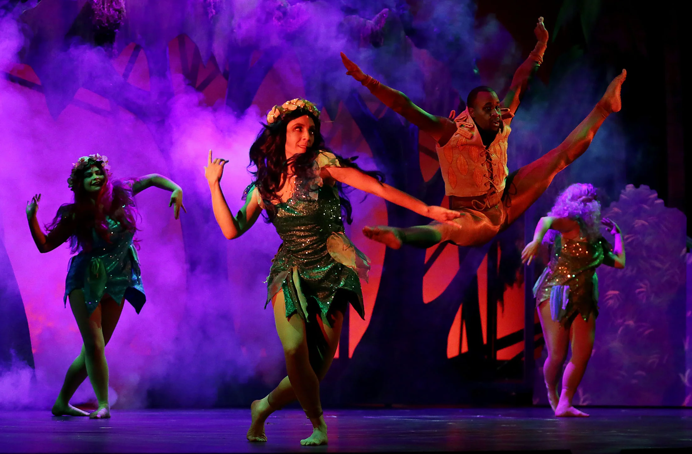 Members of the ensemble dance and sing during the Disney musical Tarzan dress rehearsal at Landis Performing Arts Center in Riverside on Wednesday, January 30, 2019.