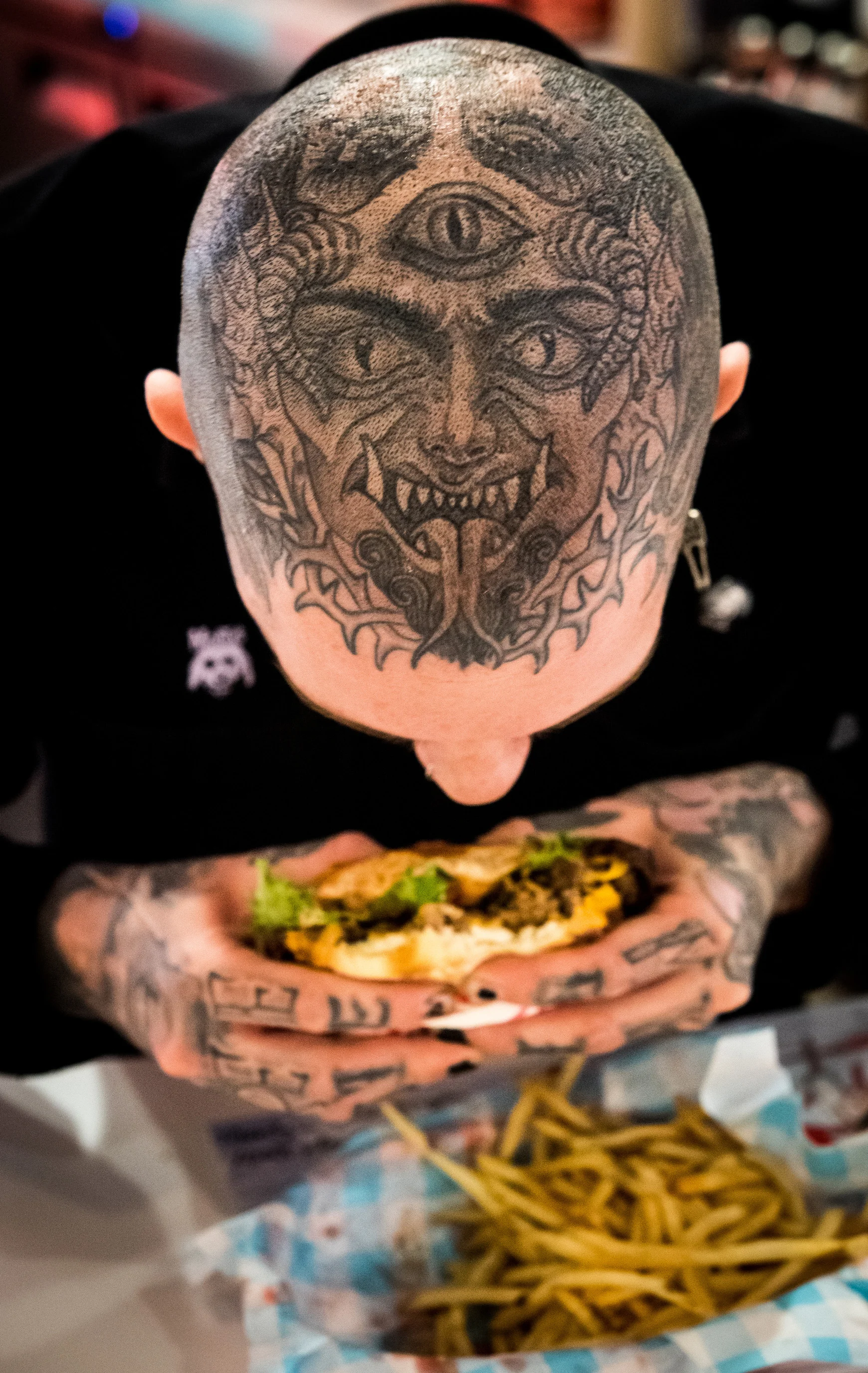 Josh Eaton, bites into his Impossible Burger before clocking in as a shift lead at Monty's Good Burger, located inside the Riverside Food Lab in Riverside on Wednesday, January 16, 2019. Monty's Good Burger is one of the first restaurants to serve t