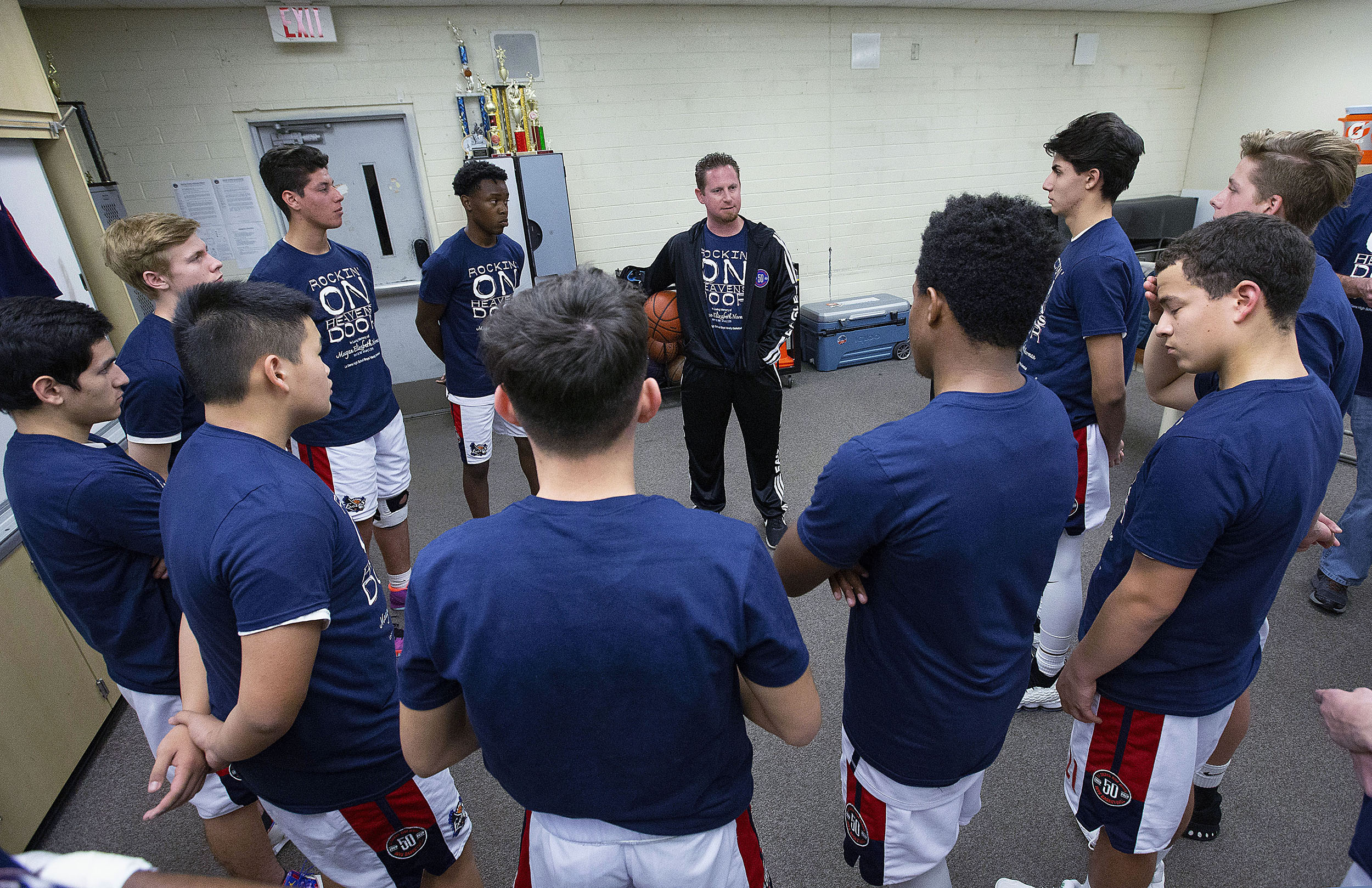 La Sierra basketball team look and listen to coach Justin Norman gets them ready to play Patriot in the team room in Riverside on Friday, January 11, 2019.