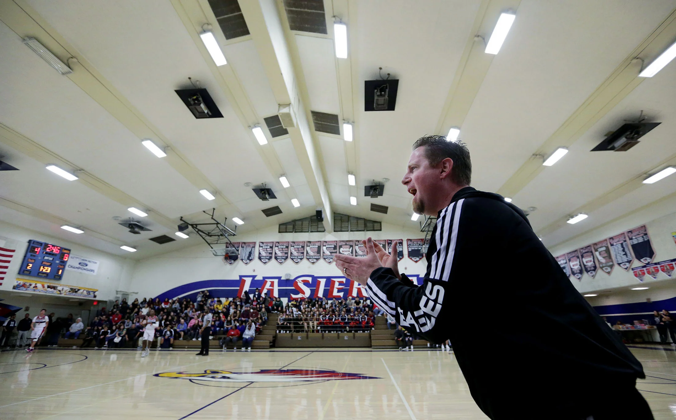 La Sierra boys basketball coach Justin Norman barks out orders to his team center court as he coach the Eagles against Patriot at La Sierra High School in Riverside on Friday, January 11, 2019.