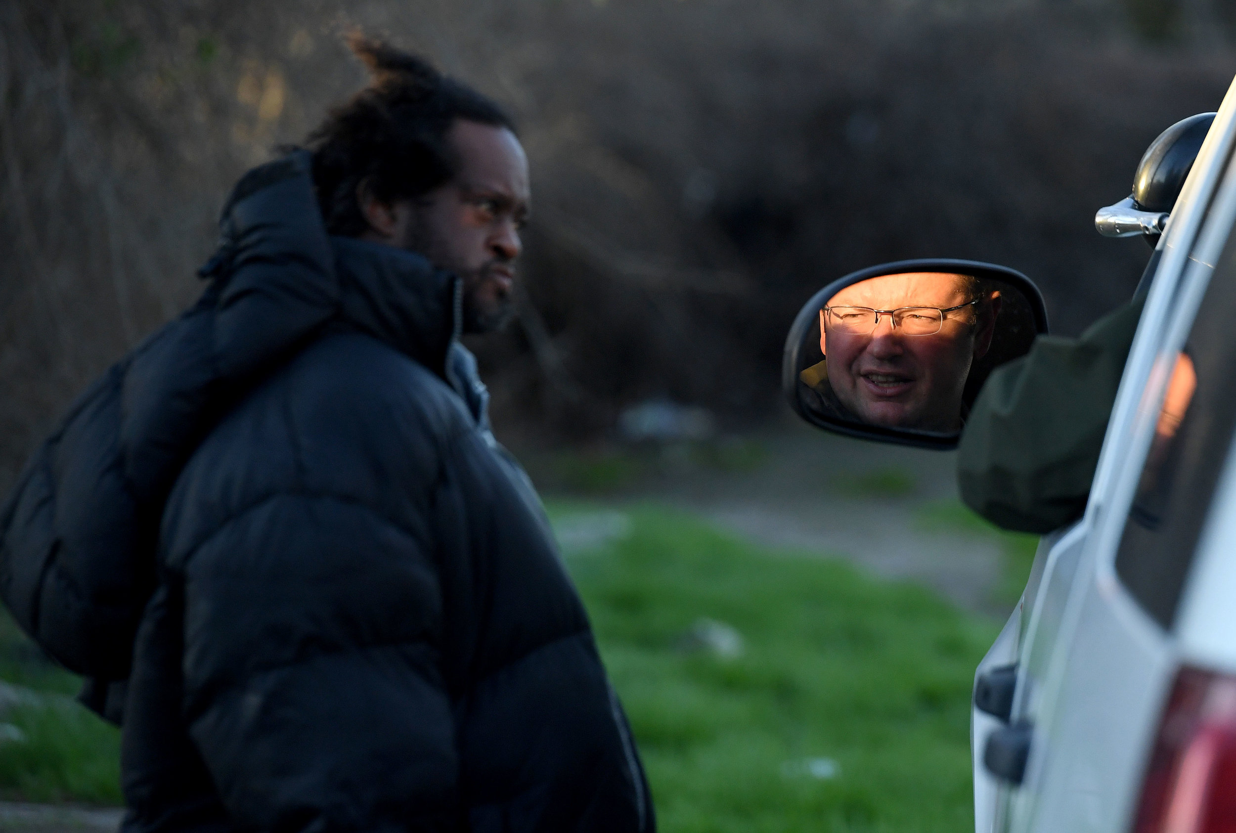  San Bernardino County Sheriff's deputy Mike Jones speaks with a homeless man found sleeping in a field off of 9th Street in San Bernardino during the San Bernardino County 2019 Point-in-Time Homeless Count in downtown San Bernardino Thursday morning