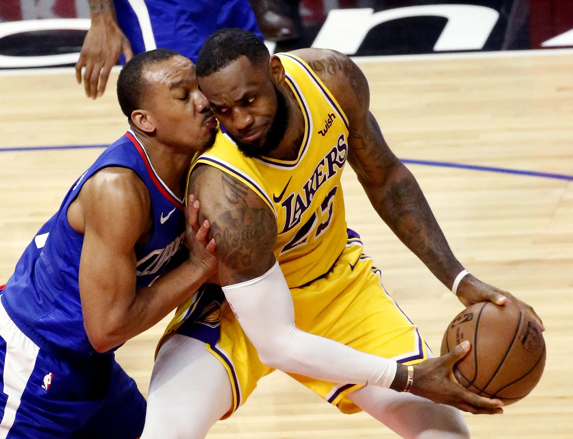  Los Angeles Clippers’ Avery Bradley (11) defends on Los Angeles Lakers’ LeBron James (23) during an NBA basketball game, Jan. 31, 2019, in Los Angeles. 