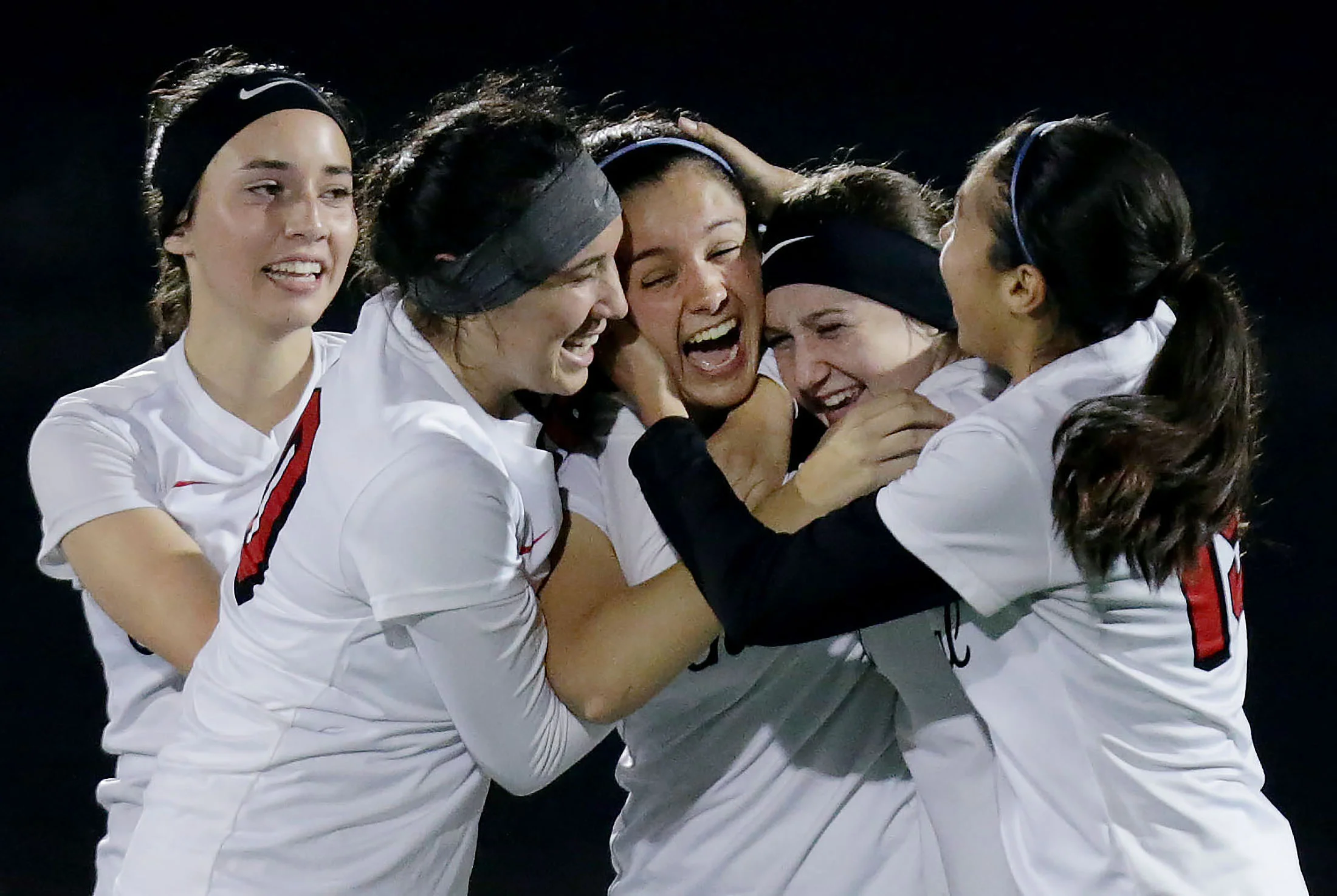Centennial players mob team mate Rachel Iacobellis #10, center after her game tying goal against Santiago in the final minutes of the Big VIII League soccer match in Corona on Thursday, January 17, 2019.