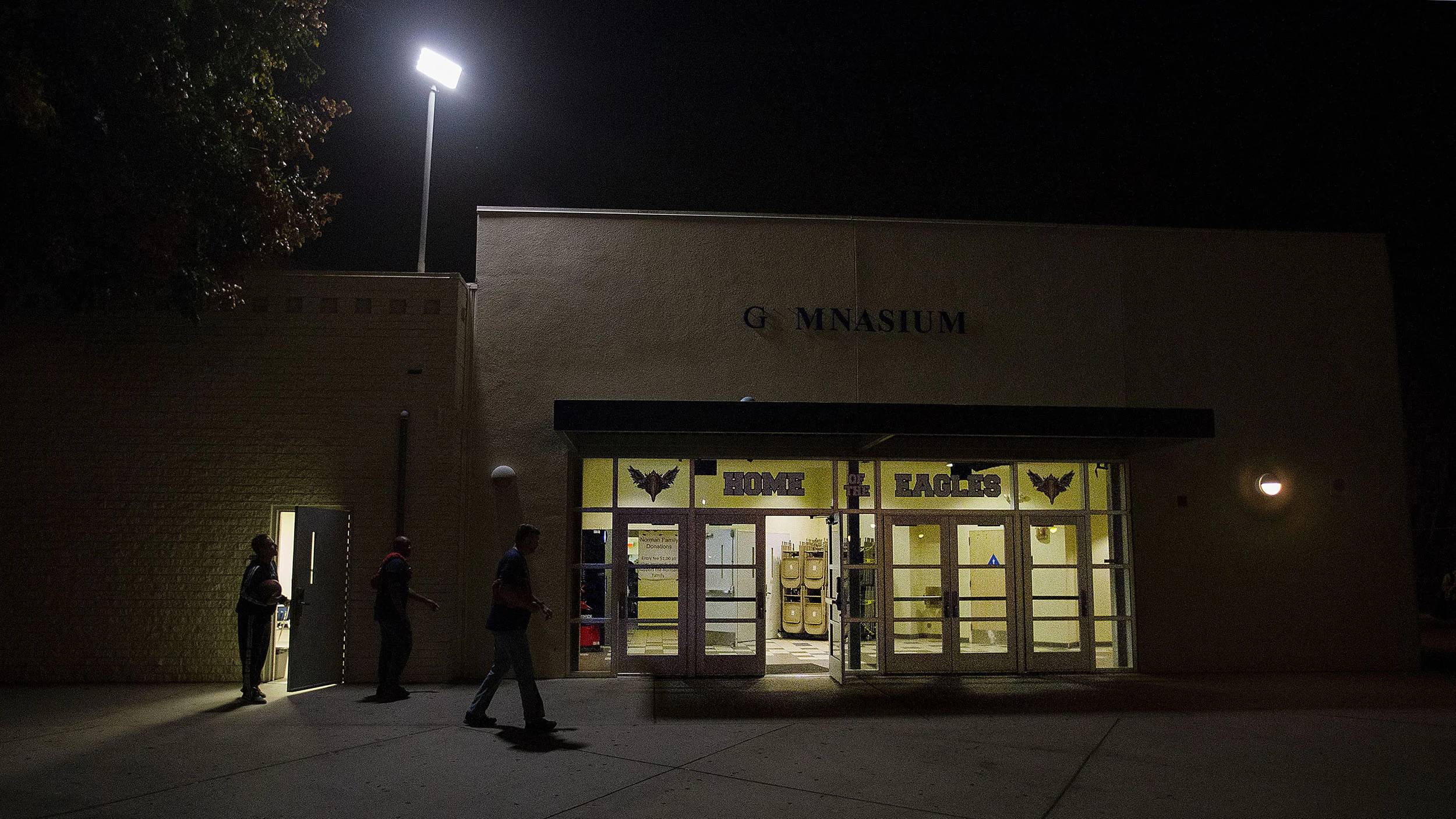 La Sierra boys basketball coach Justin Norman locks the team room door as he heads back into the gym after a pre-game meeting before playing the Patriots 10 days after the sudden death of his wife, Meagan, at La Sierra High School in Riverside on Friday, January 11, 2019.