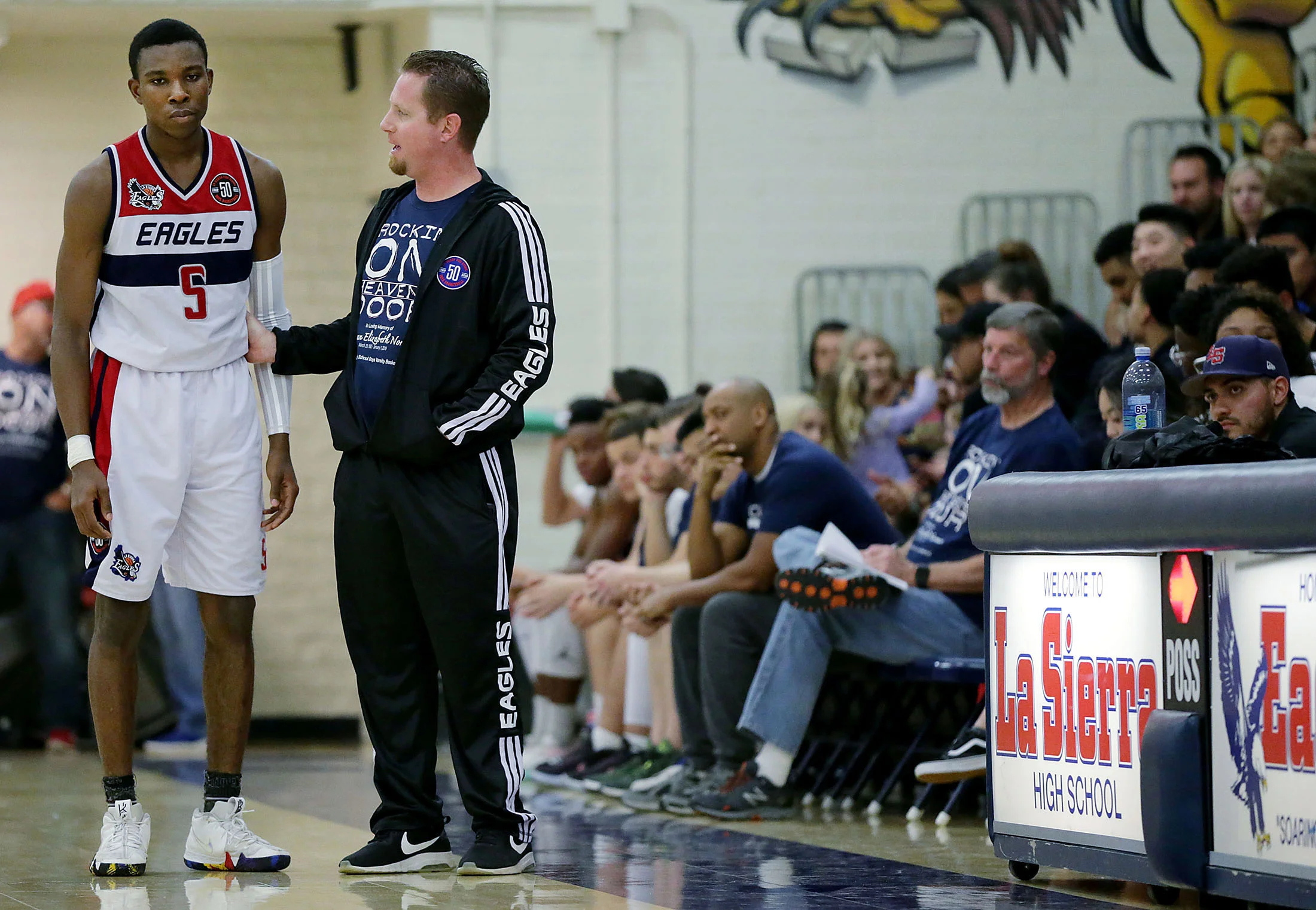 La Sierra's Otuekong Ekong #5 listens to head coach Justin Norman in the first half o f the game against Patriot at La Sierra High School in Riverside on Friday, January 11, 2019.