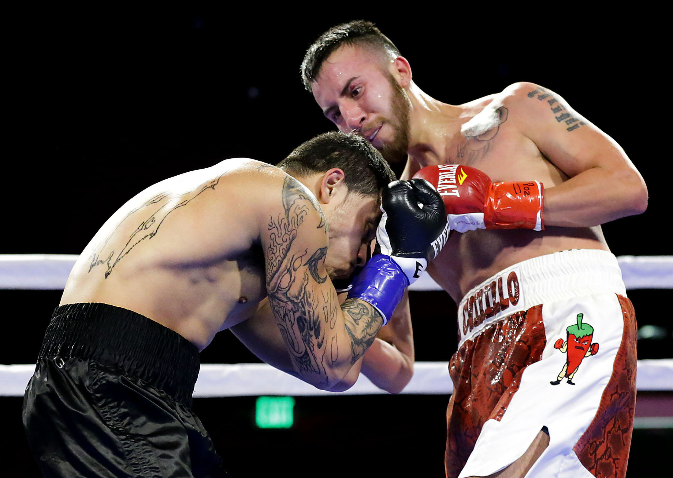 Boxers Carlos Saucedo, right lands a punch as he boxes Misael Chacon in the first round of their super featherweight bout at Florentine Gardens in Hollywood on Saturday, February 16, 2019. PUBLISHED Feb. 21, 2019