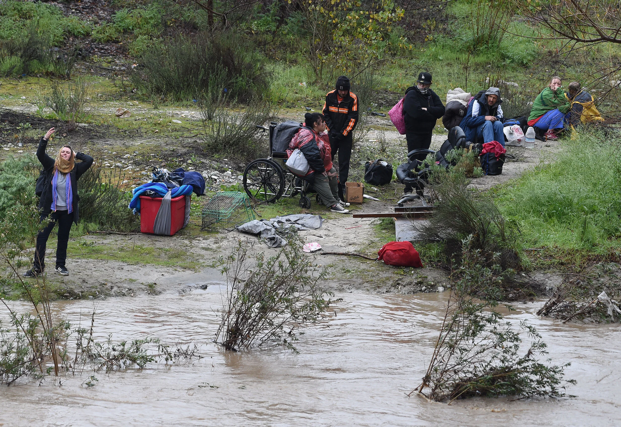  A San Bernardino County Fire swift rescue team rescued 8 individuals stranded on an island in the rain swollen Santa Ana River bed Thursday, February 14, 2019.  