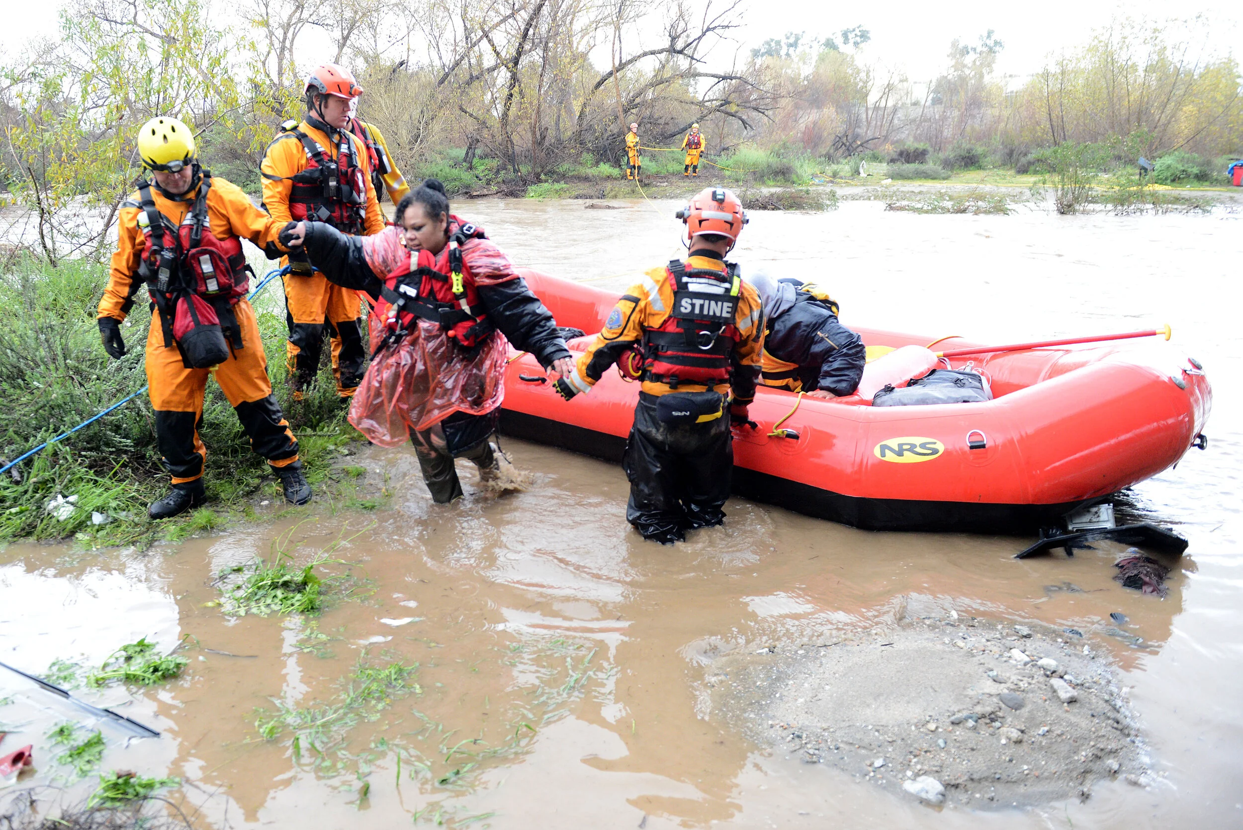  A San Bernardino County Fire swift rescue team rescued 8 individuals stranded on an island in the rain swollen Santa Ana River bed Thursday, February 14, 2019.  