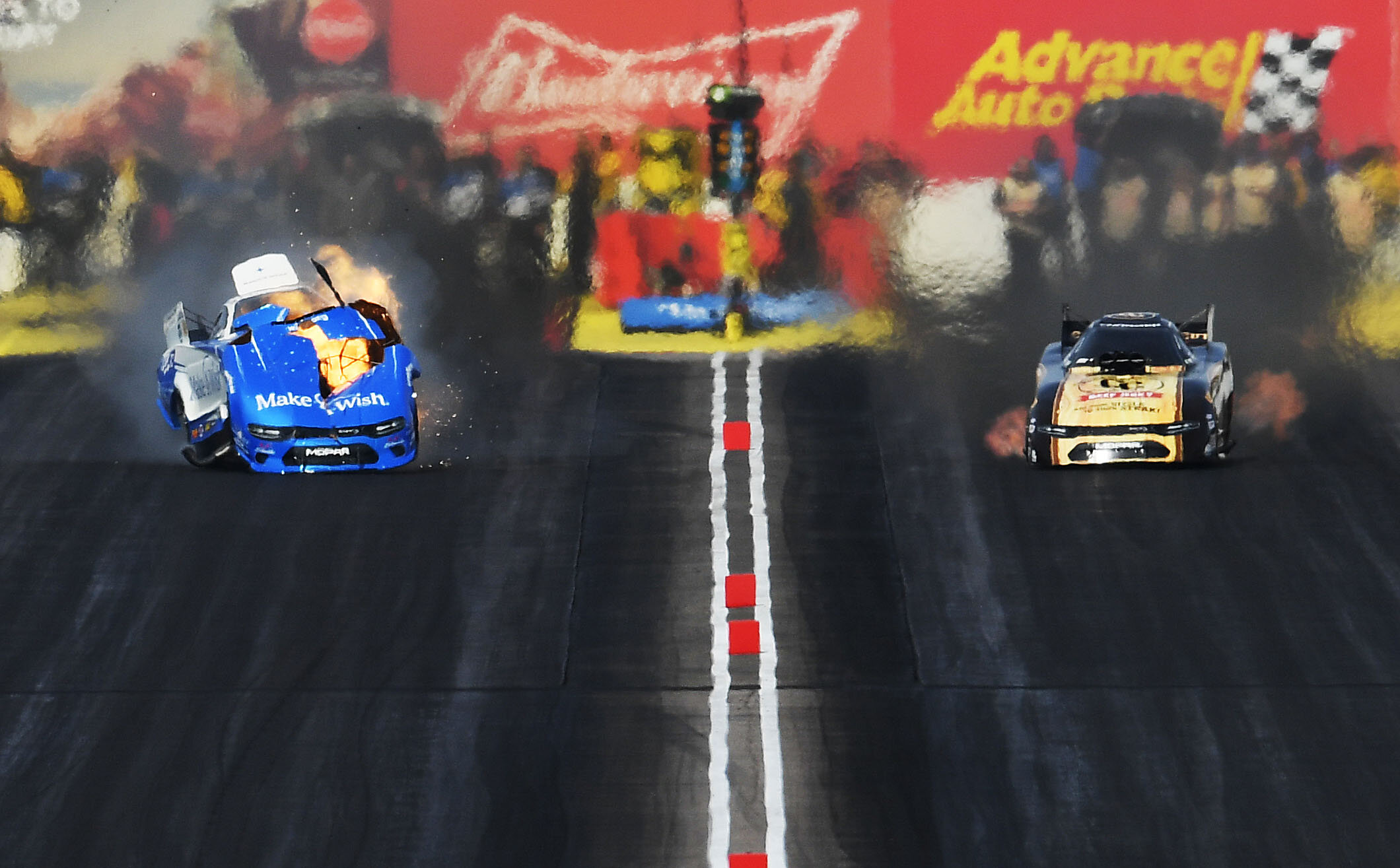  Funny Car driver Tommy Johnson Jr. explodes his engine as he races against Jim Campbell during the opening round of eliminations at the 35th annual NHRA Arizona Nationals in Chandler, Arizona Sunday February 24, 2019. Billy Torrence (Top Fuel), Matt