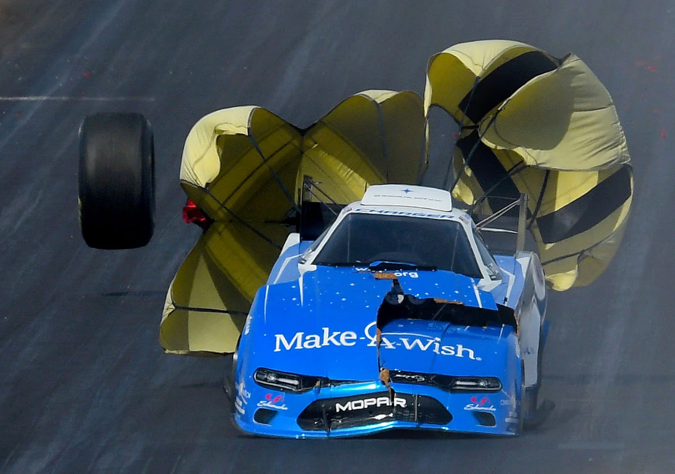 The tire of Tommy Johnson Jr.'s Funny Car bounces down the track after breaking his rear axle during the opening round of eliminations at the 35th annual NHRA Arizona Nationals in Chandler, Arizona Sunday February 24, 2019. Billy Torrence (Top Fuel)