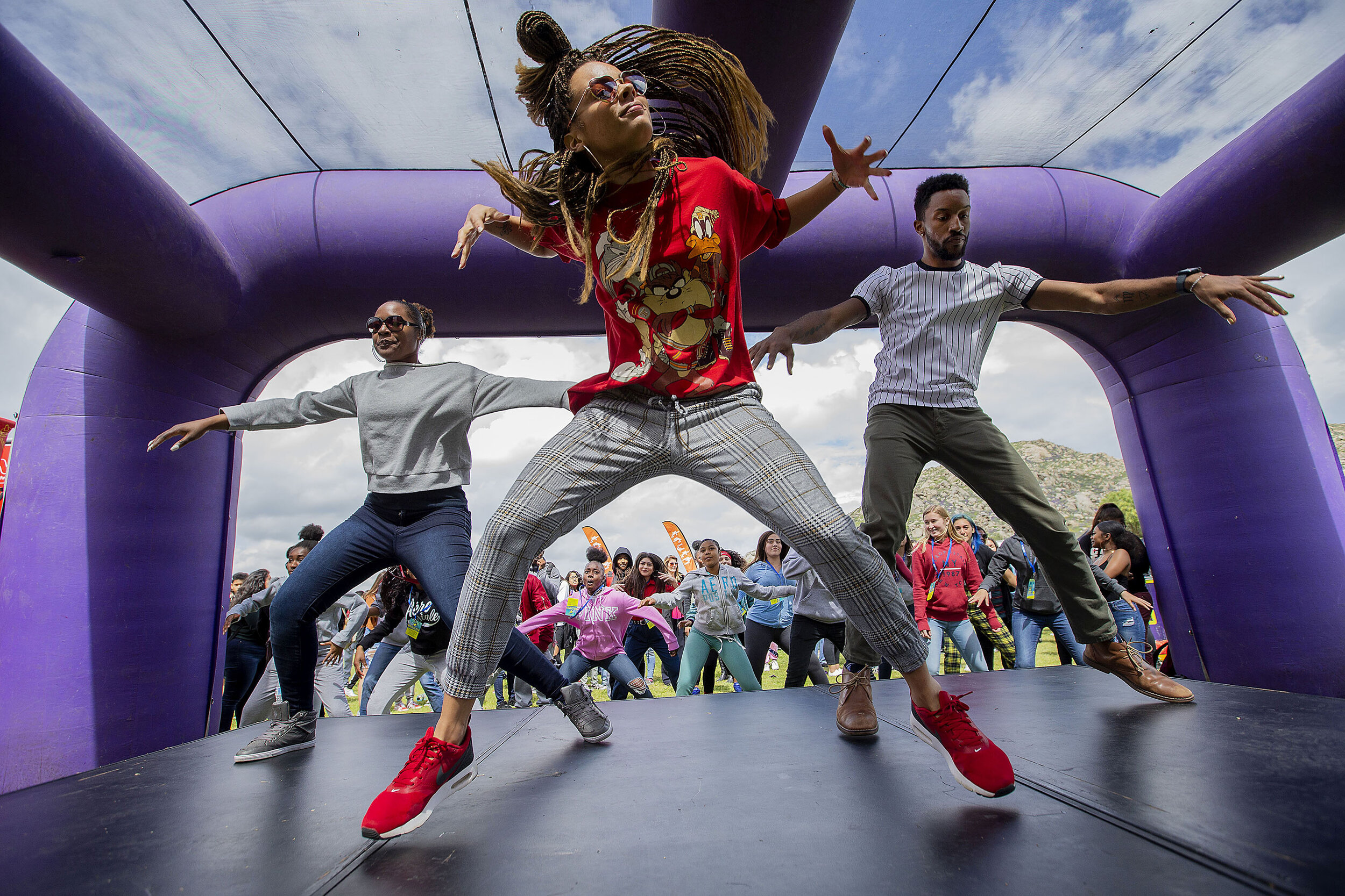 Takis Dancer Liz Legrande, center teaches steps to members of Rancho Verde High's Mustang Dance Company during High School Nation, a music festival tour at Rancho Verde High in Moreno Valley on Wednesday, March 20, 2019.