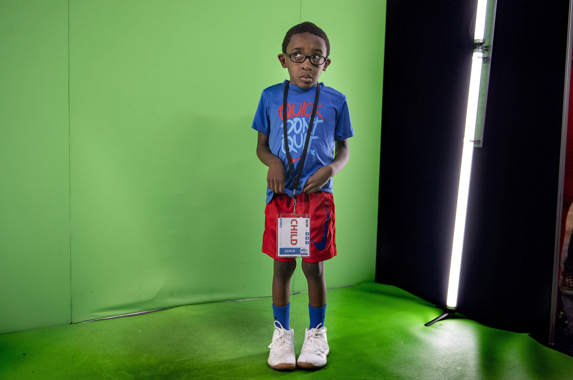Four-year-old Jackson Edwards is overcome with stage fright after waiting in line for the Shazam! photo booth at WonderCon in Anaheim on Sunday, March 31, 2019. The booth allowed participants to let loose and see themselves in super hero form on a T