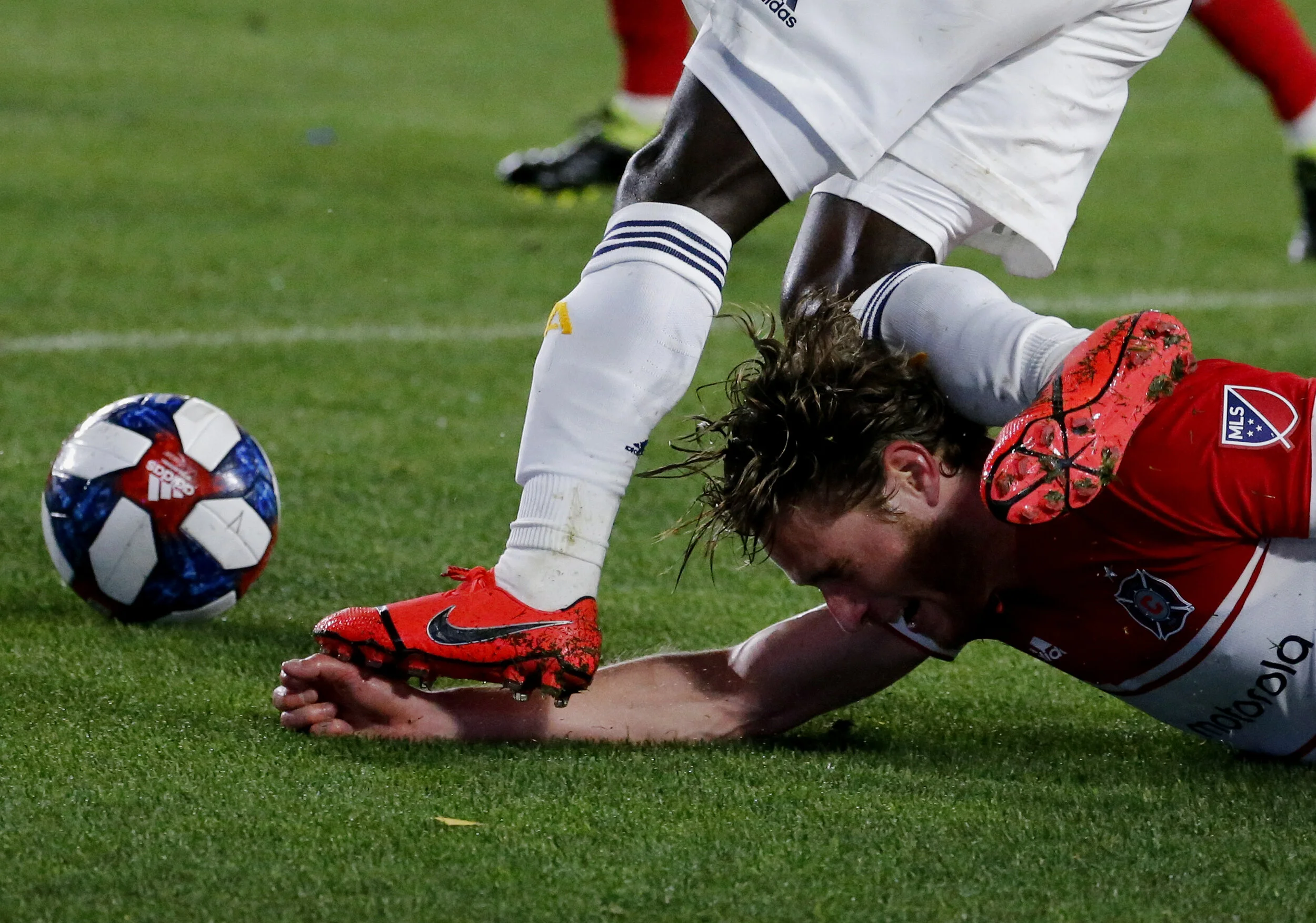 Chicago Fire defender Nicolas Hasler (22) of Liechtenstein, collides with LA Galaxy defender Rolf Feltscher (25) of Switzerland, an MLS soccer match between LA Galaxy and Chicago Fire in Carson, Calif., Saturday, March 2, 2019. The Galaxy won 2-1.  