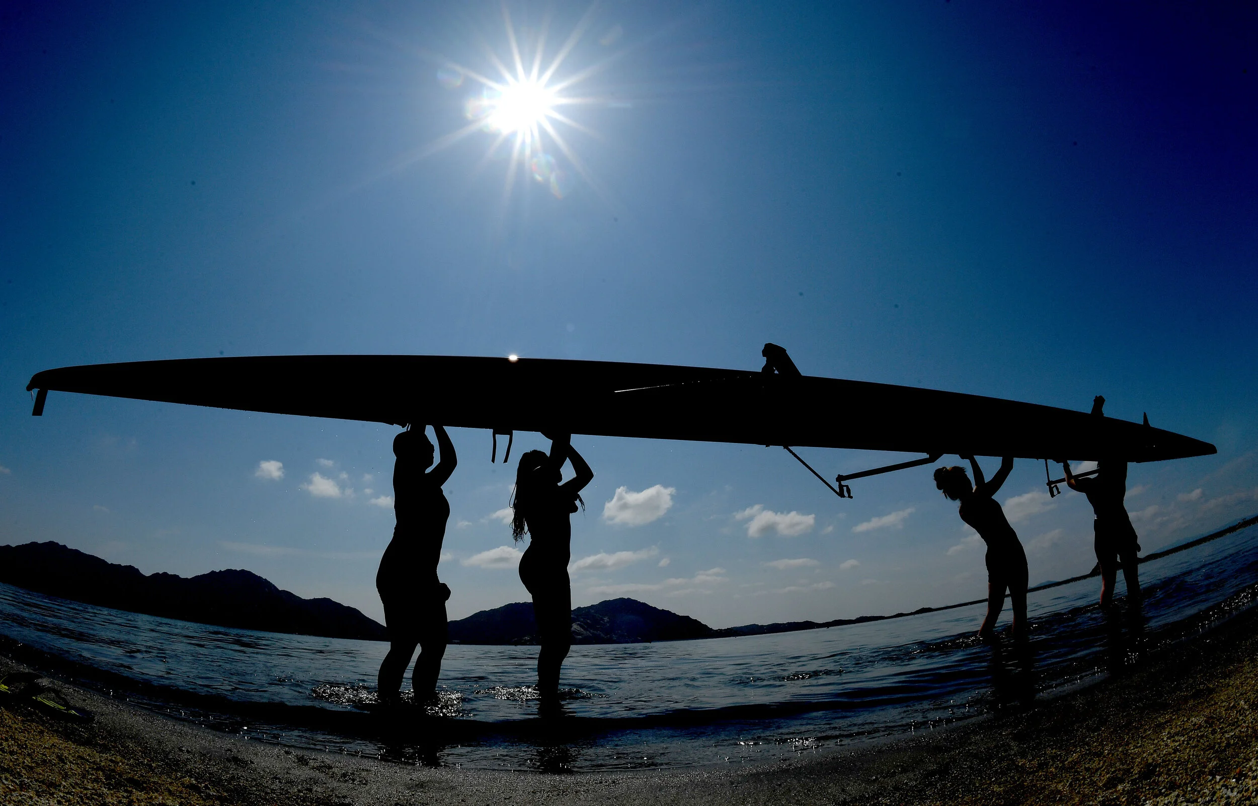  Rowers remove their racing shell from the water following their heat during the Empire Sprints at the Lake Perris State Recreation Area on Sunday, March 24, 2019. Over 800 high school age students from 22 rowing clubs took part in the 2-day event co