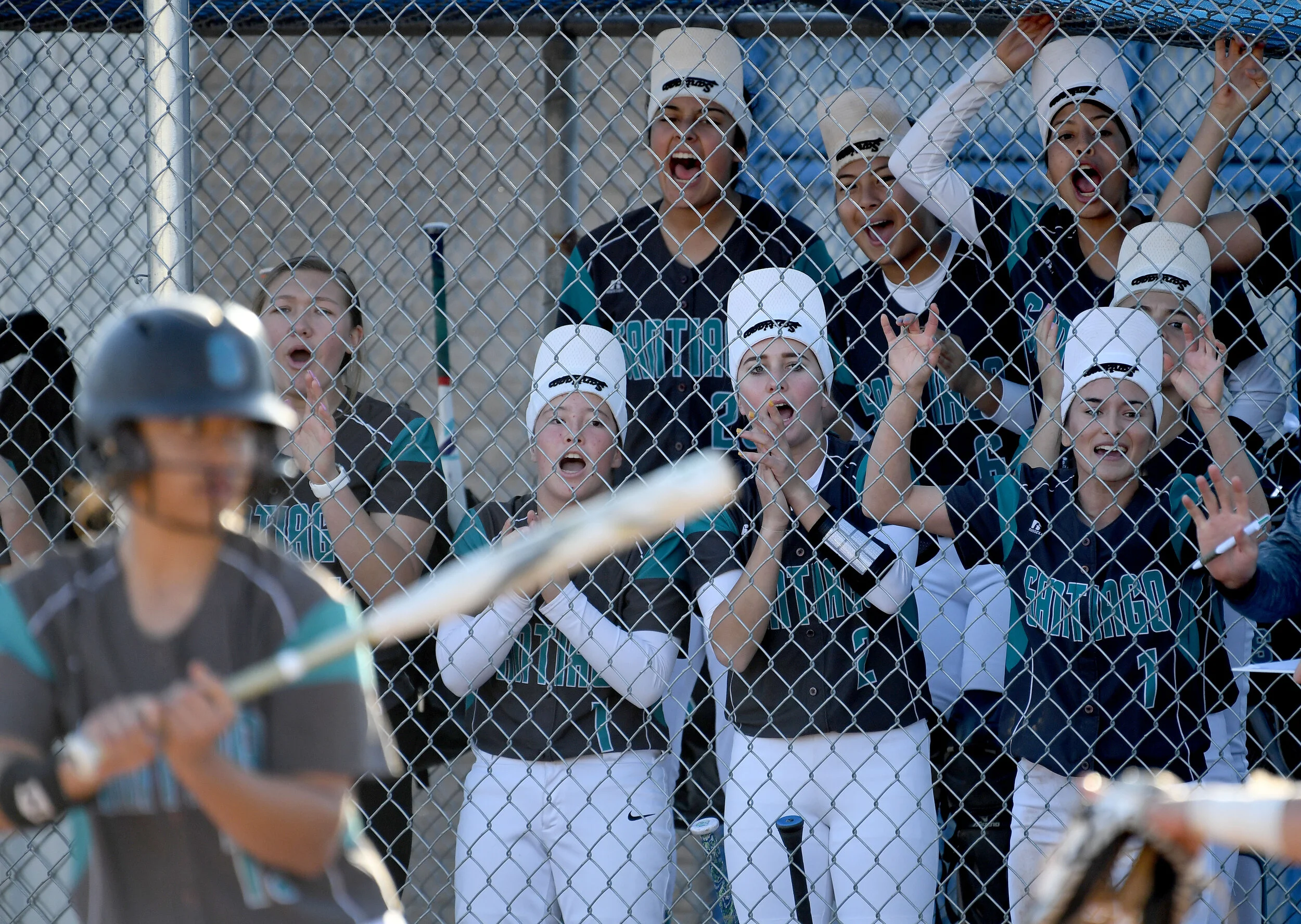  Santiago players put on their rally caps during the top of the 7th inning Tuesday, March 12, 2019 against Norco. Norco, the No. 1 ranked team in the country, defeated Santiago in a Big VIII league softball game 1-0. (Photo by Will Lester, Inland Val