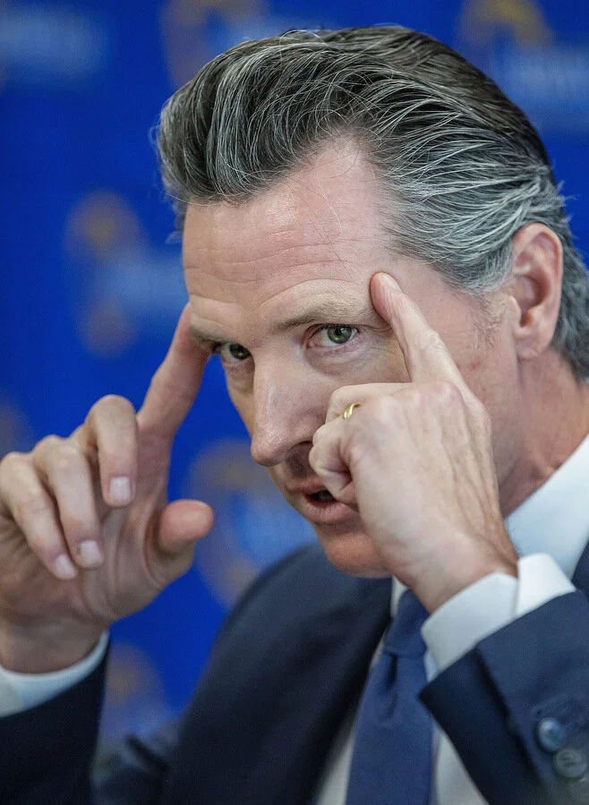  Gov. Gavin Newsom talks with formerly homeless individuals, service providers and local officials at the Arrowhead McKee Family Health Center in San Bernardino on Tuesday, April 16, 2019.  
