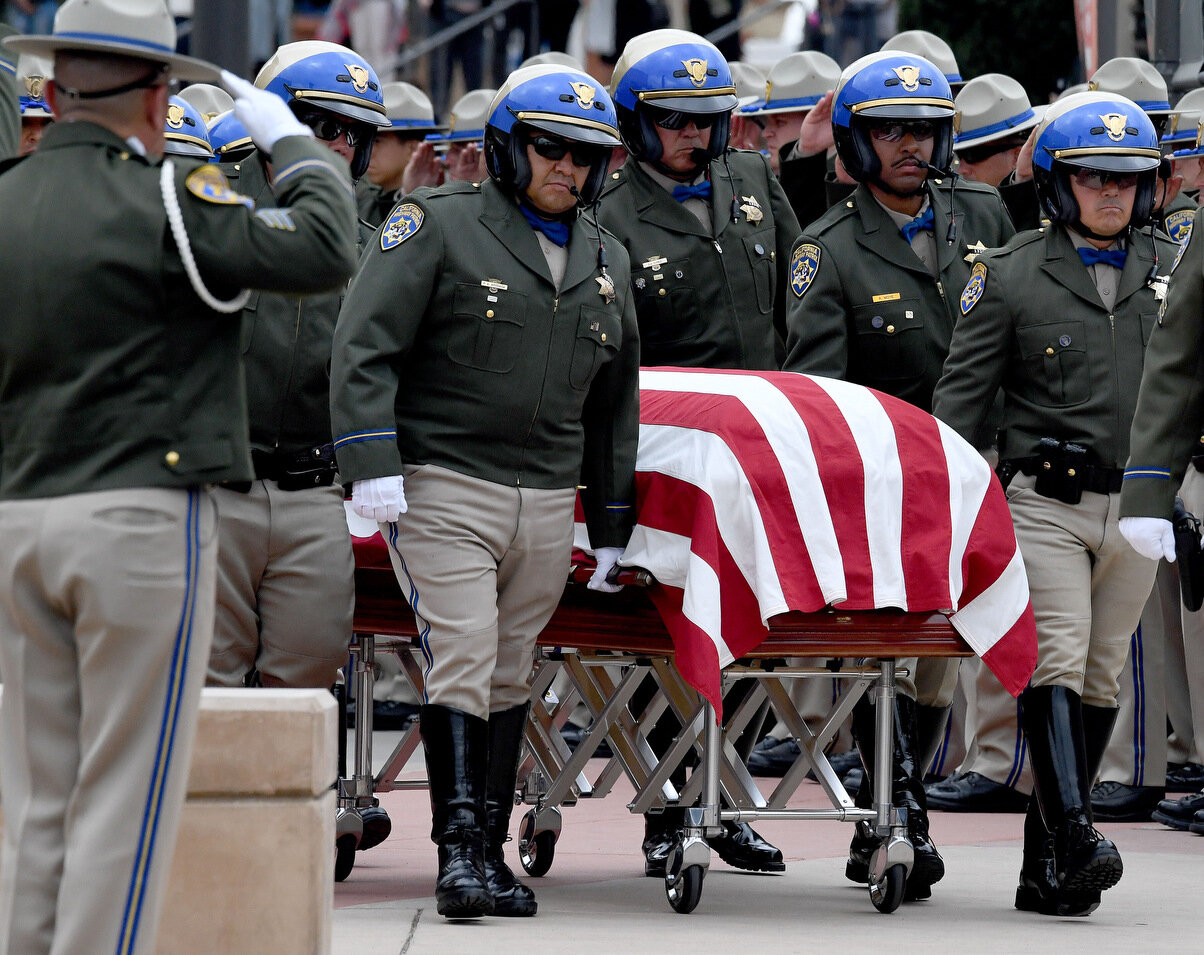  California Highway Patrol officers escort the casket of CHP Sgt. Steve Licon to a waiting hearse following funeral services at Harvest Christian Fellowship church in Riverside Tuesday, April 16, 2019. The CHP Sgt. was killed after he pulled over a c