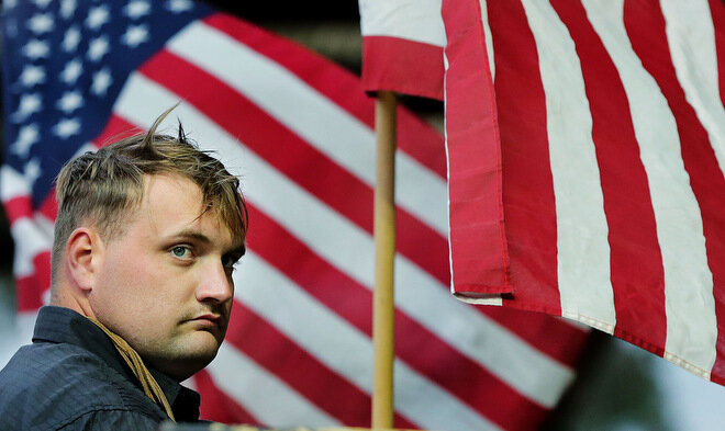  Bull rider Adam Hulse waits for his bull on top of the shut amongst Old Glory during the second annual Yucaipa Rodeo at  Yucaipa Equestrian Center under the new Dottie Potter Memorial Arena cover in Yucaipa on Friday, April 5, 2019.  