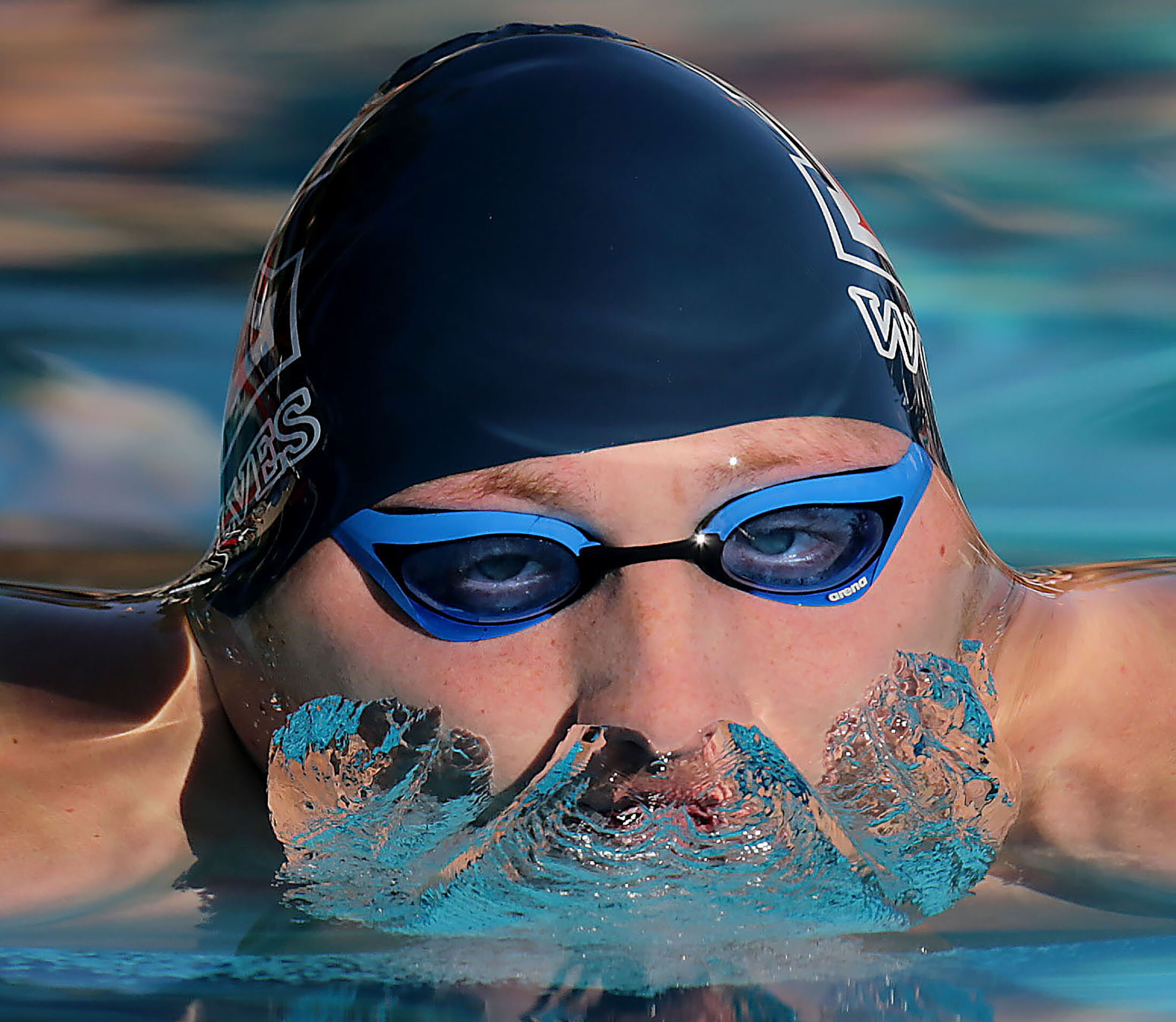  King's Benjamin Wolf competes in the100 yard breaststroke setting a new record during the Big VIII League’s swimming championships at the Riverside Aquatics Complex in Riverside on Thursday, April 25, 2019. 