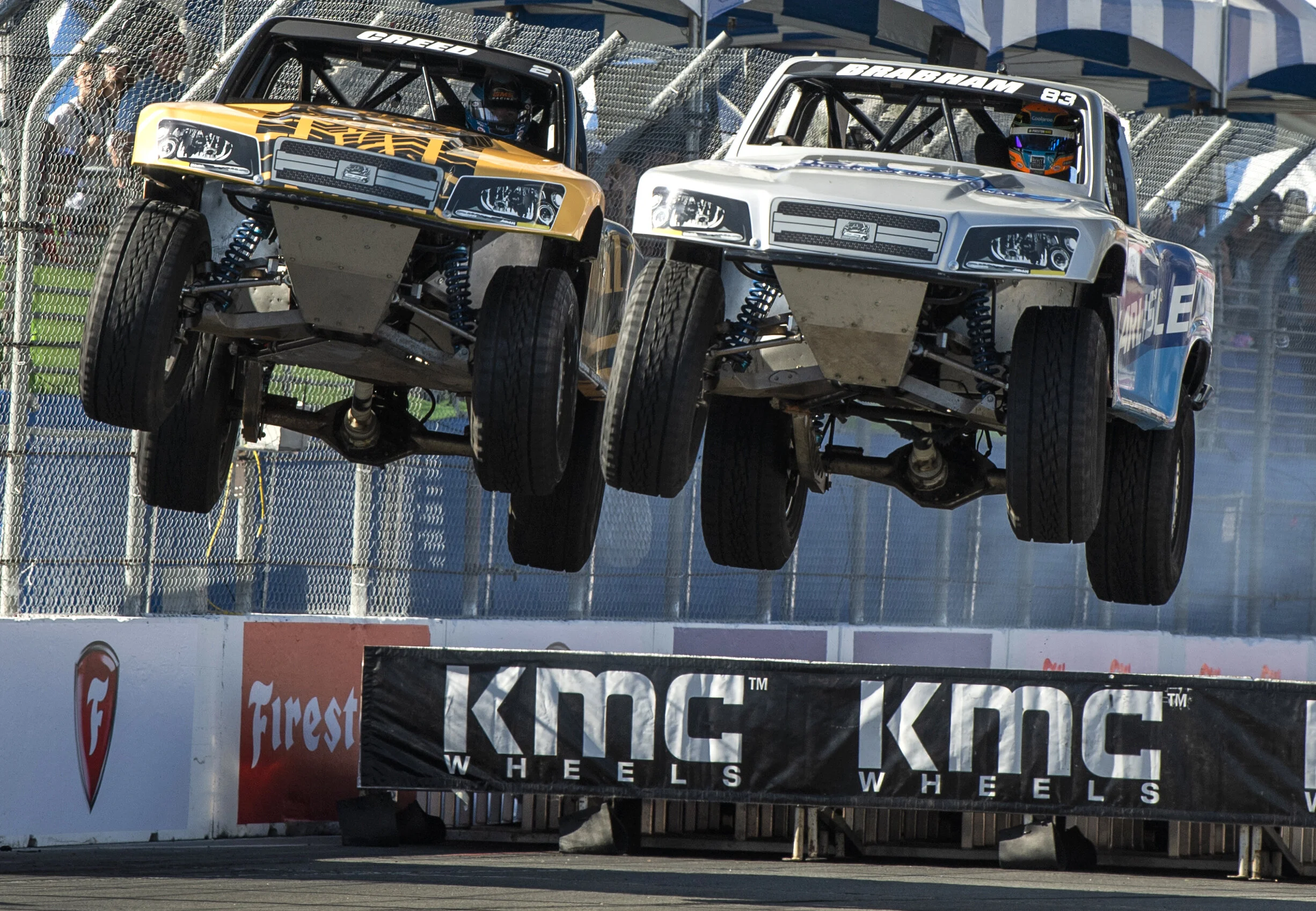  Sheldon Creed #2 left, and Matt Brabham,#83 right, battle for first as they hit a ramp during the Speed Energy Stadium Super Trucks at the Acura Grand Prix of Long Beach weekend in Long Beach Saturday, April 13, 2019. 