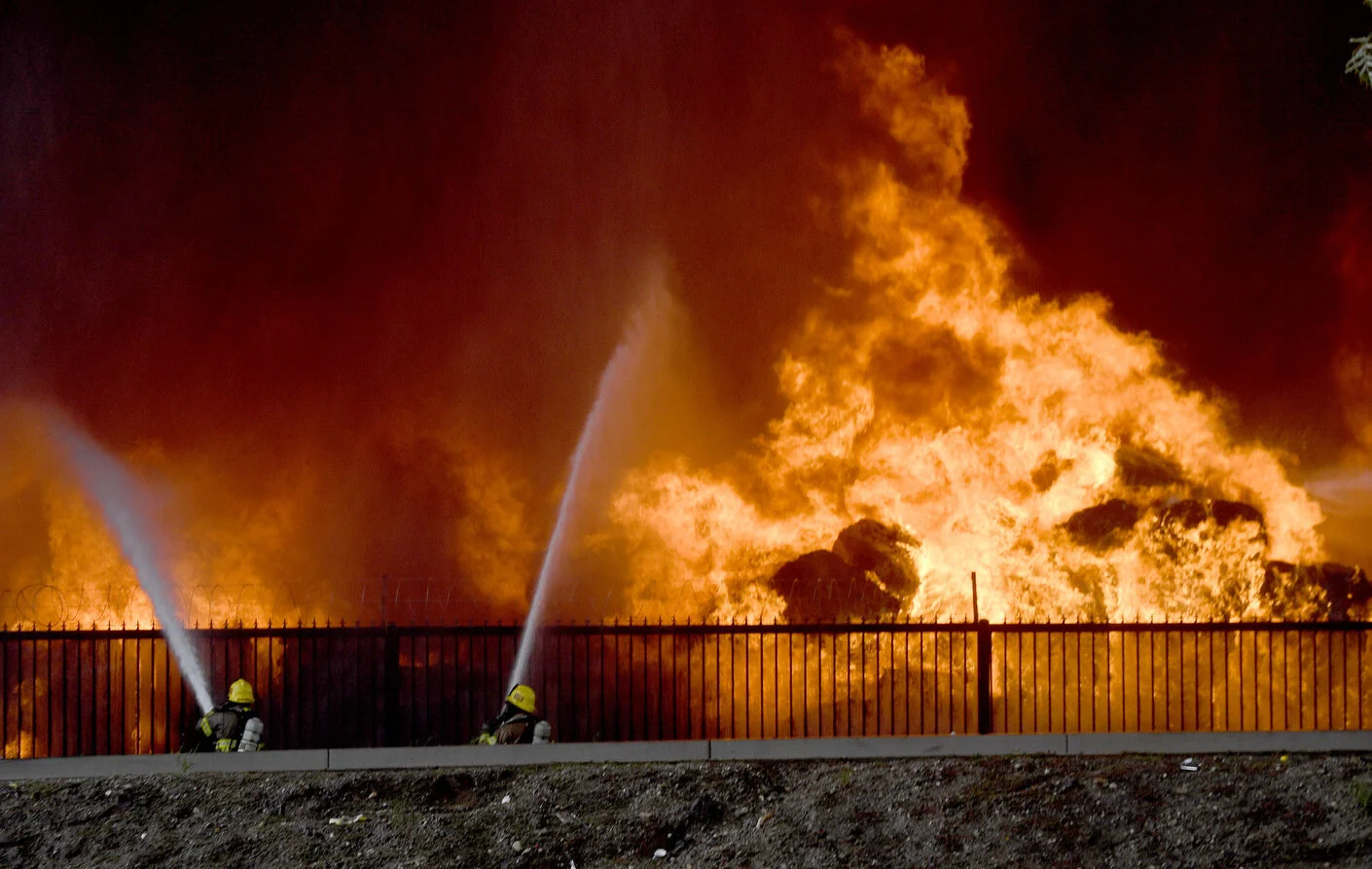  Ontario firefighters, along with assistance from other cities, work on a multi alarm fire at a recycling facility on State Street in Ontario Tuesday April 30, 2019. The cause of the blaze is under investigation, which has caused the closure of railr