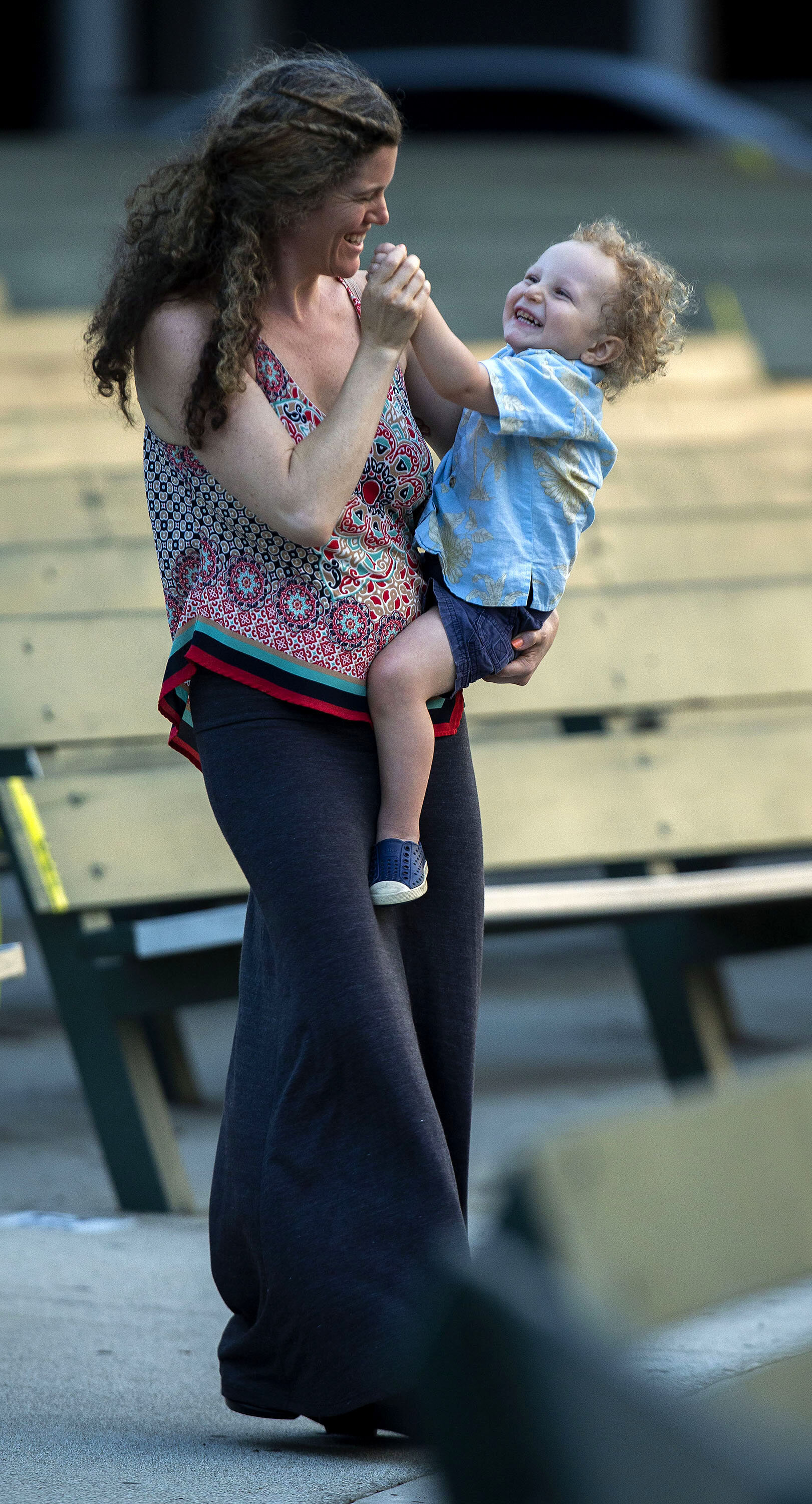 Alexis Cox dances with her son Noa Home, 2, to the sounds of Highland Music Company as they perform on the Redlands Bowl stage during Festival Concert Salute to the Troops as part of the Redlands Festival of Arts in Redlands on Friday, May 24, 2019.
