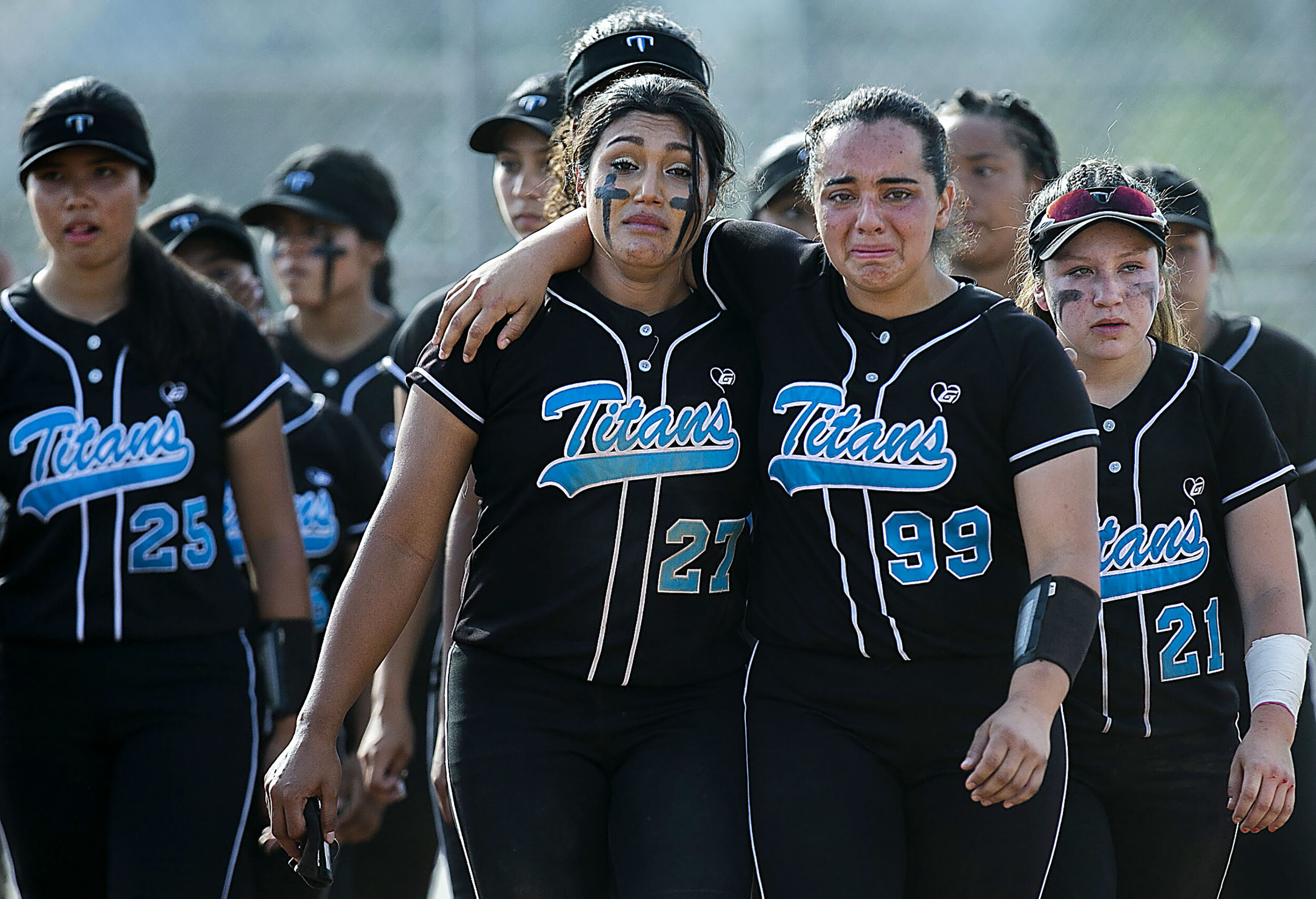 Grand Terrace outfielder Alycia Flores #27 and Grand Terrace catcher Luz Aguilasocho #99 walk off the field after the 3-2 loss to Huntington Beach in the CIF Southern Section Division 1 softball first-round game in Grand Terrace on Thursday, May 2,
