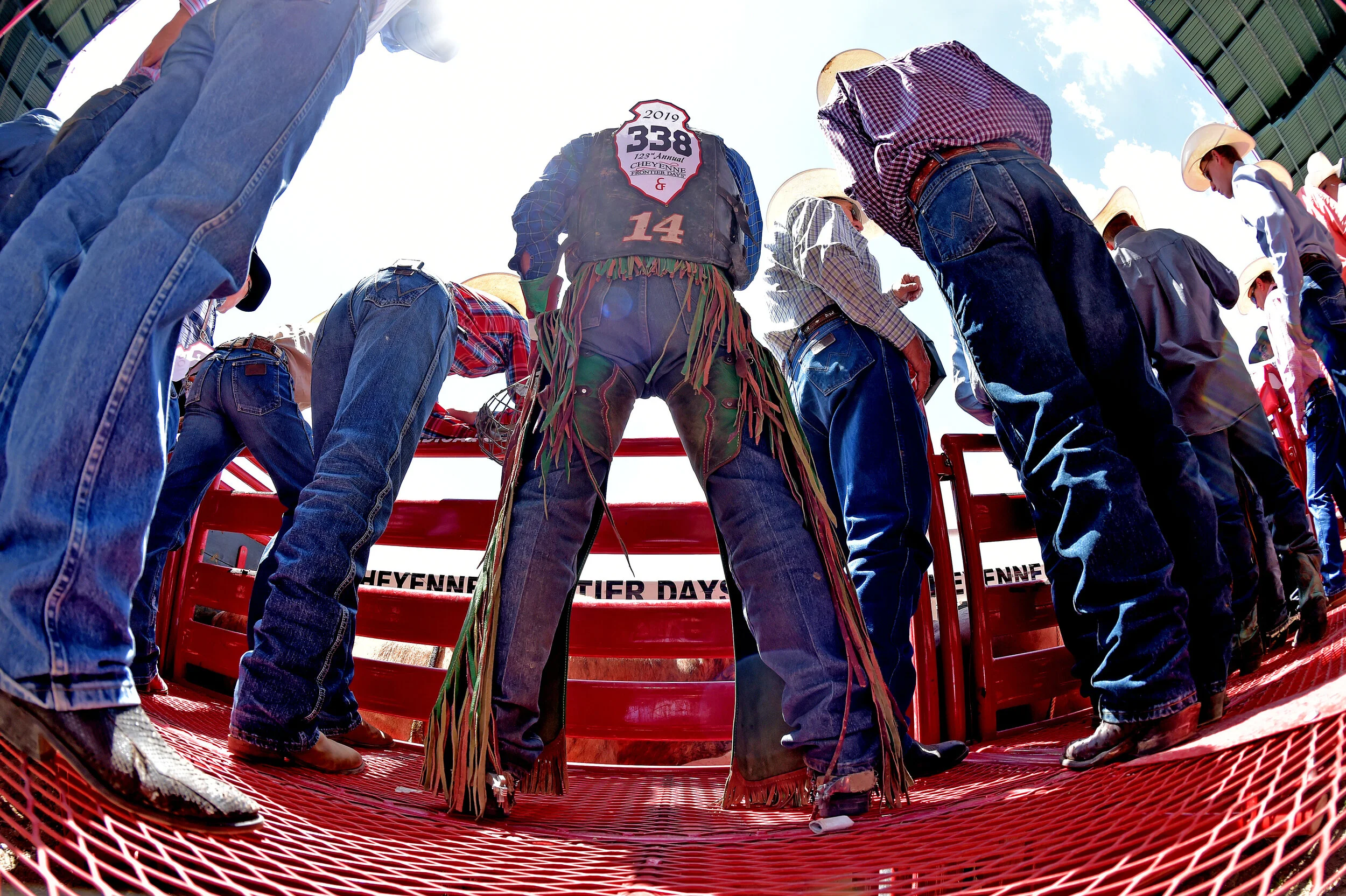  Contestants wait behind the bucking chutes for their event during the 123rd Cheyenne Frontier Days Rodeo in Cheyenne, Wyoming.  