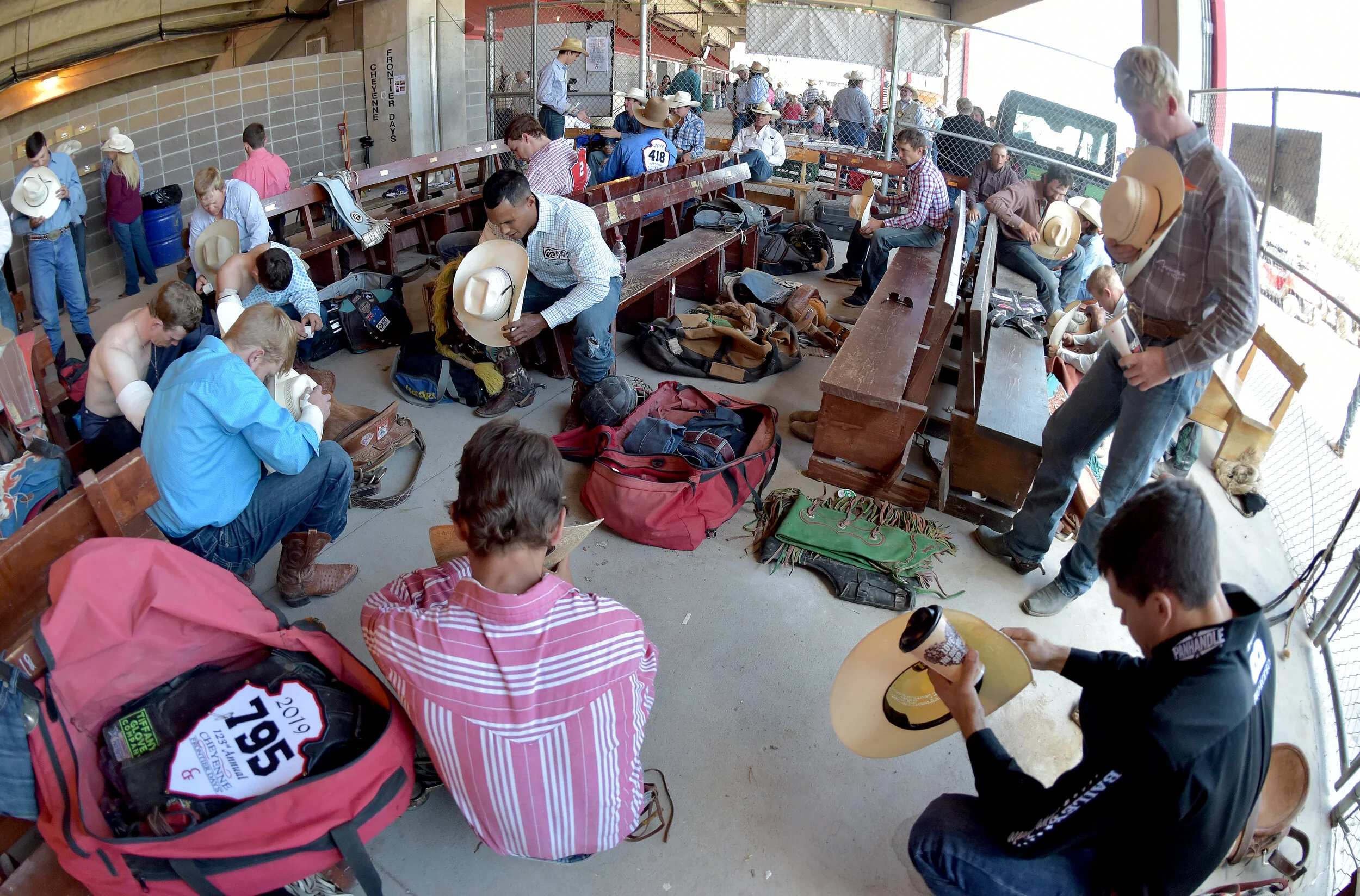  Bareback rider Anthony Thomas (top left) leads cowboys in a moment of prayer Tuesday July 23, 2019 prior to competing at the 123rd Cheyenne Frontier Days Rodeo in Cheyenne, Wyoming. 