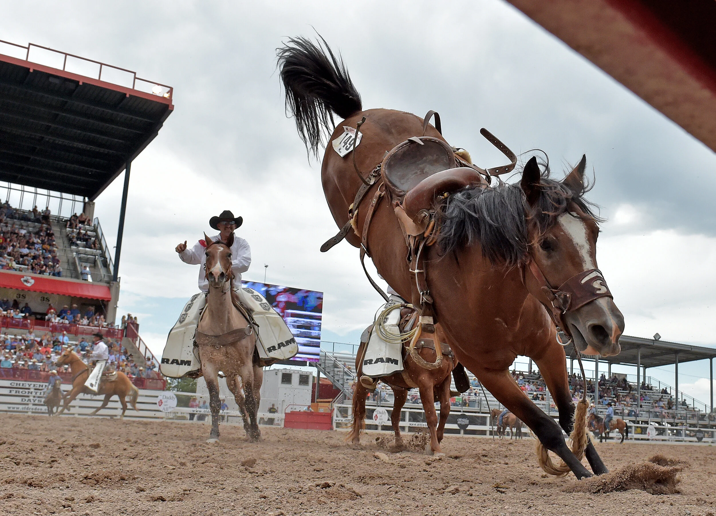  Wranglers chase after a loose horse in the Frontier Park arena Wednesday July 24, 2019 during the 123rd Cheyenne Frontier Days Rodeo in Cheyenne, Wyoming.  