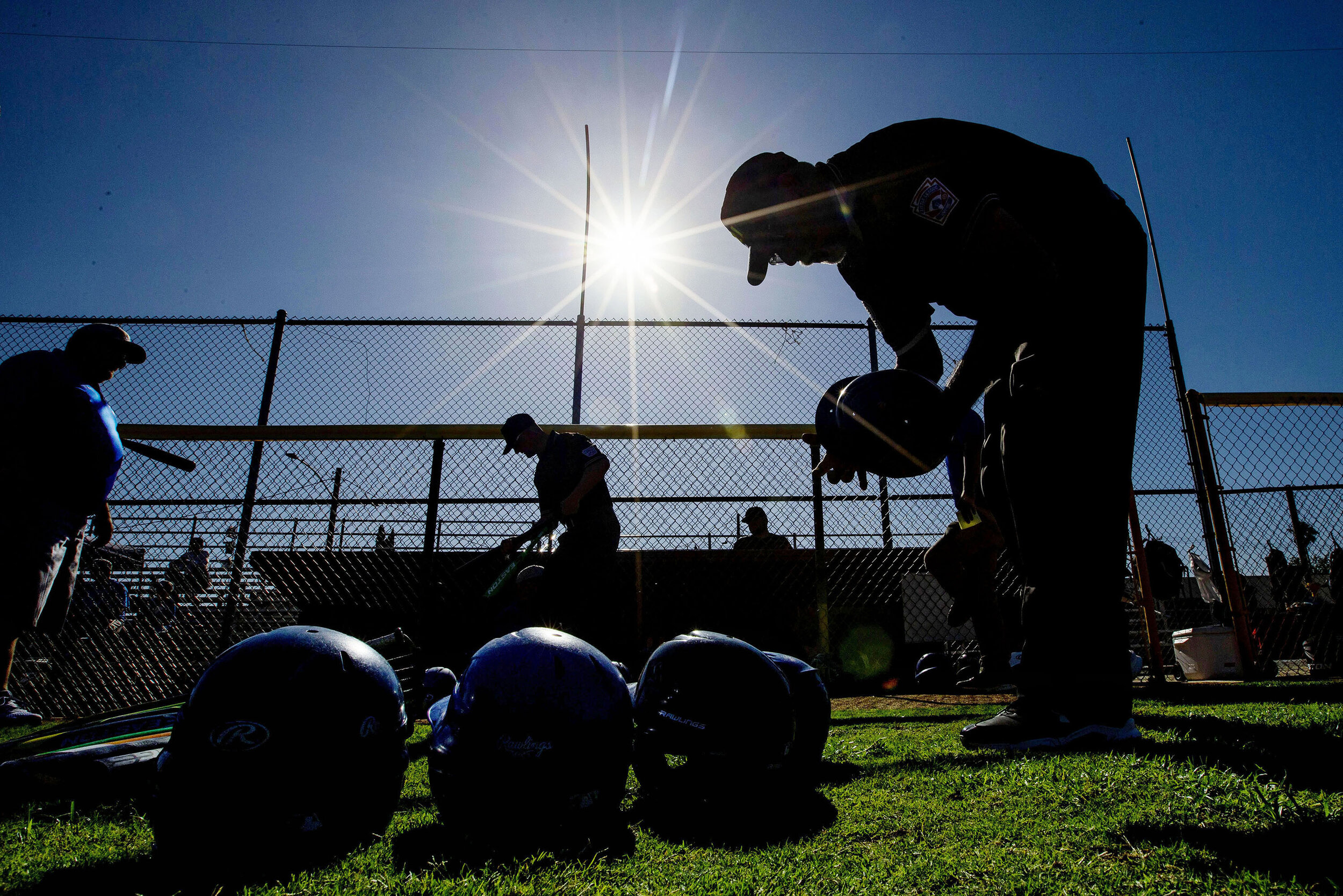 Little League District 21 umpire Anthony Estrada checks players equipment before the start of the playoffs for the Little League World Series at Ken Hubbs Memorial Little League Park in Colton on Monday, July 1, 2019.