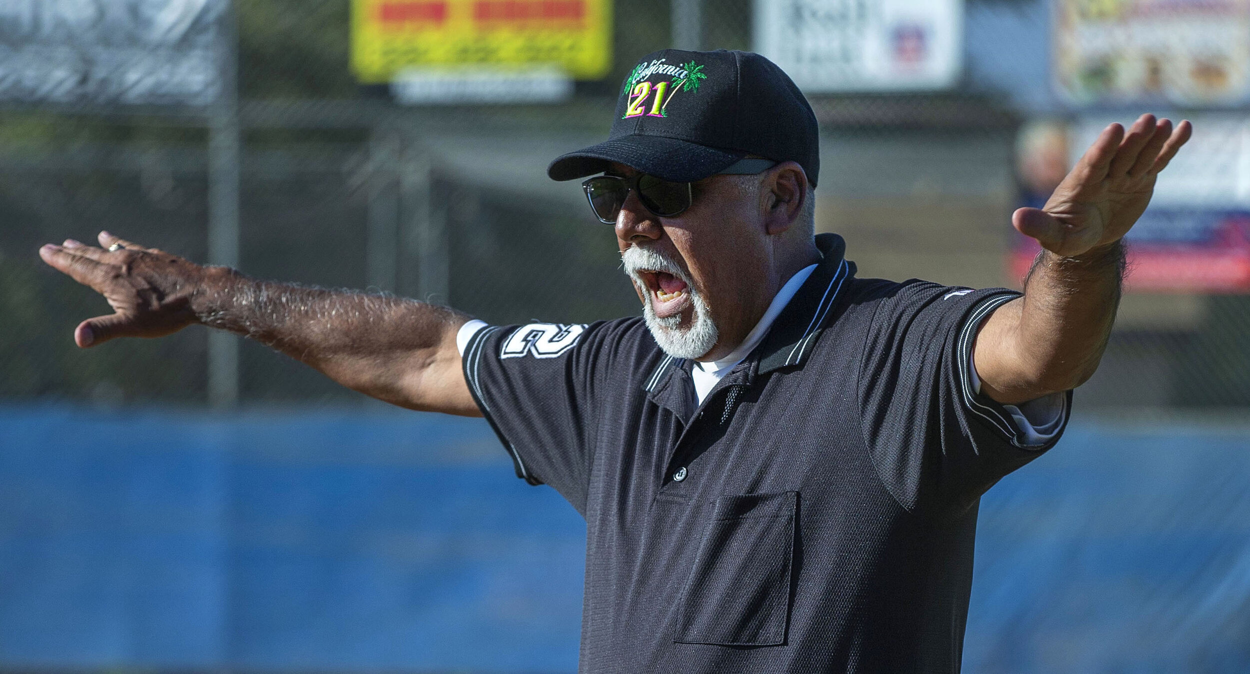 Little League District 21umpire Anthony Estrada makes the safe call at first base during a little league playoff at Ken Hubbs Memorial Little League Park in Colton on Monday, July 1, 2019.