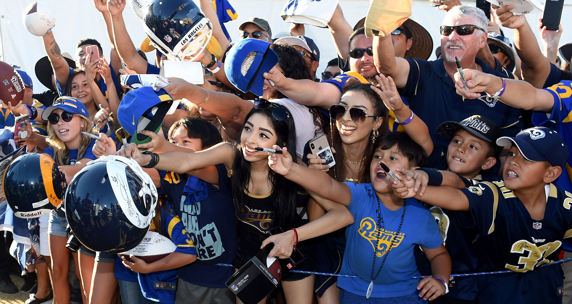  Fans wait for players to sign autographs during the Los Angeles Rams training camp on the campus of UC Irvine on Saturday, July 27, 2019 in Irvine, California. 