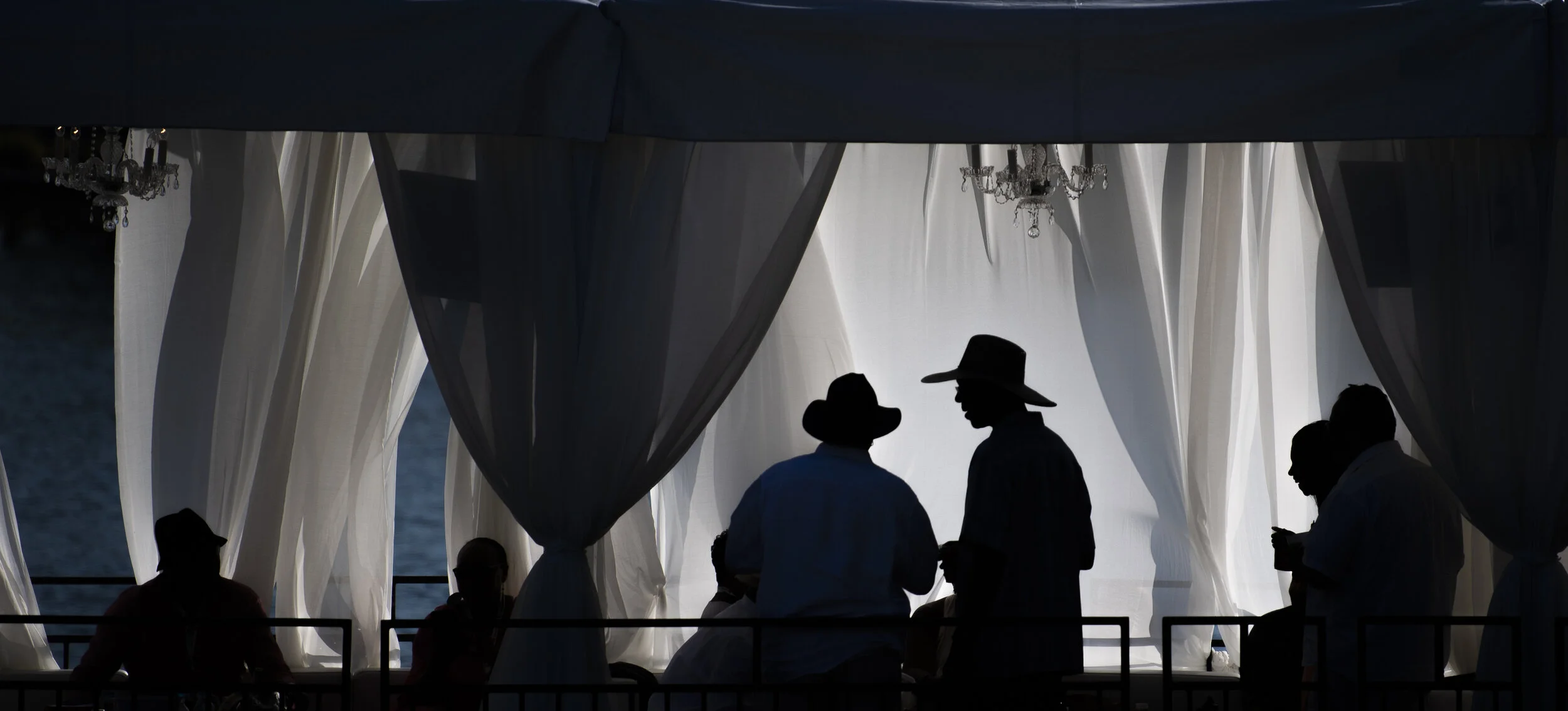  Cabana ticket holders are seen as the sunsets and backlights the tents during the 32nd Annual Long Beach Jazz Festival in Long Beach Saturday, August 10, 2019.  