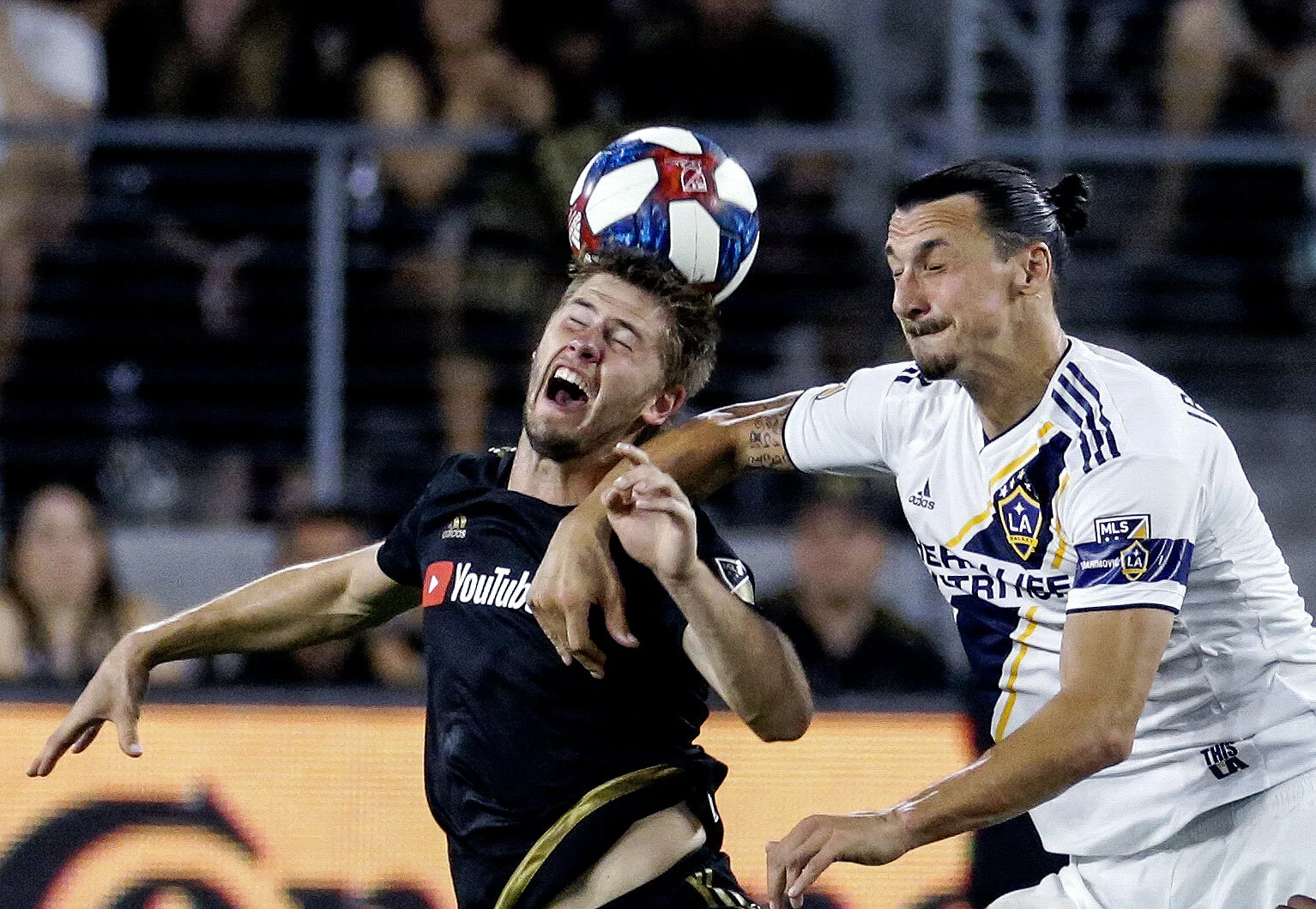  LA Galaxy forward Zlatan Ibrahimovic (9) and Los Angeles FC defender Walker Zimmerman (25) battle for the head ball during the 2019 Major League Soccer (MLS) match between LA Galaxy and Los Angeles FC in Los Ageles, August 25, 2019. 