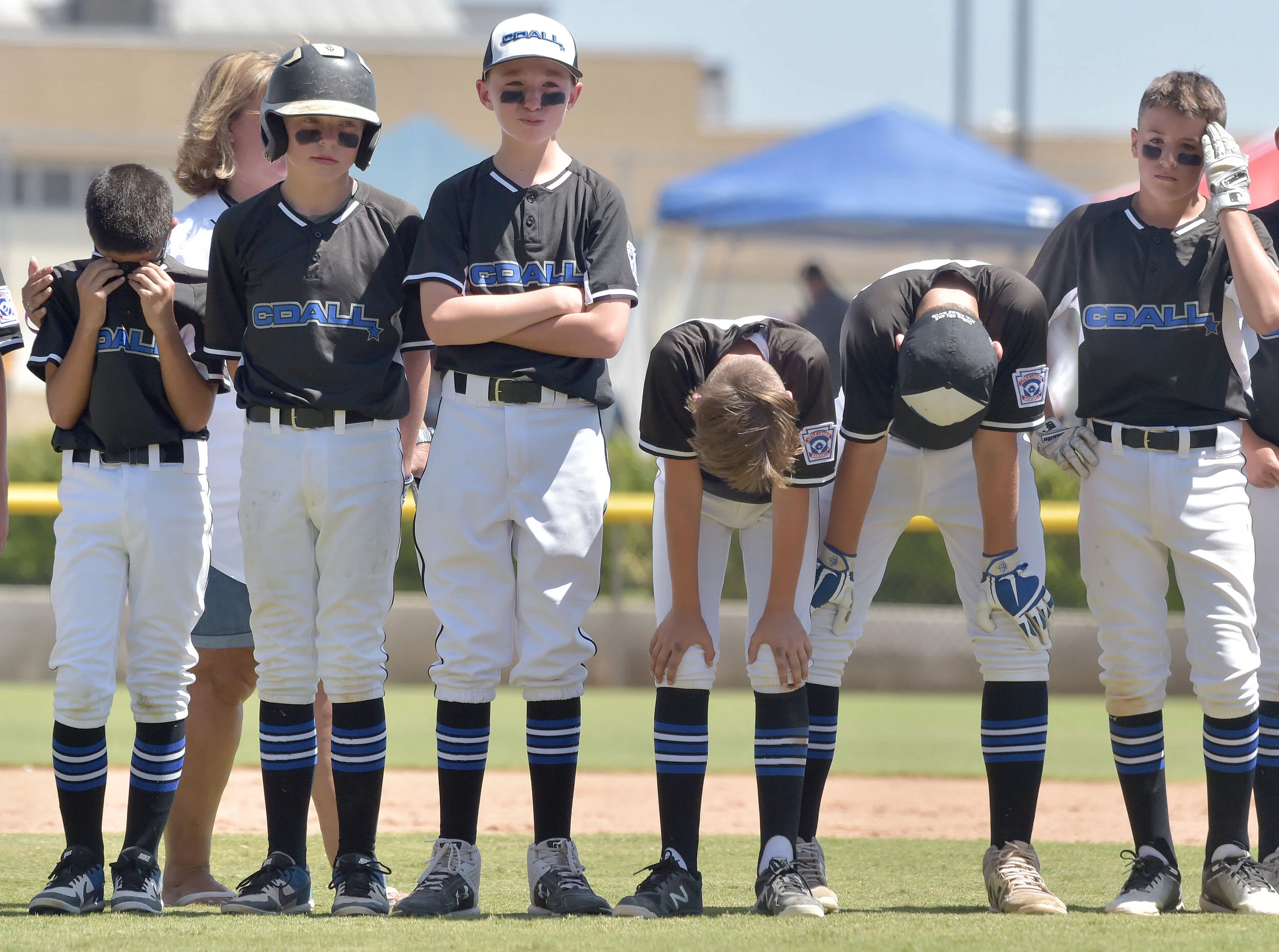  Idaho players show their disappointment after losing to Oregon in the Little League Northwest Regional Championship game at Al Houghton Stadium in San Bernardino Saturday, Aug 10, 2019. Sprague Little League, from Salem, Oregon defeated Coeur d'Alen