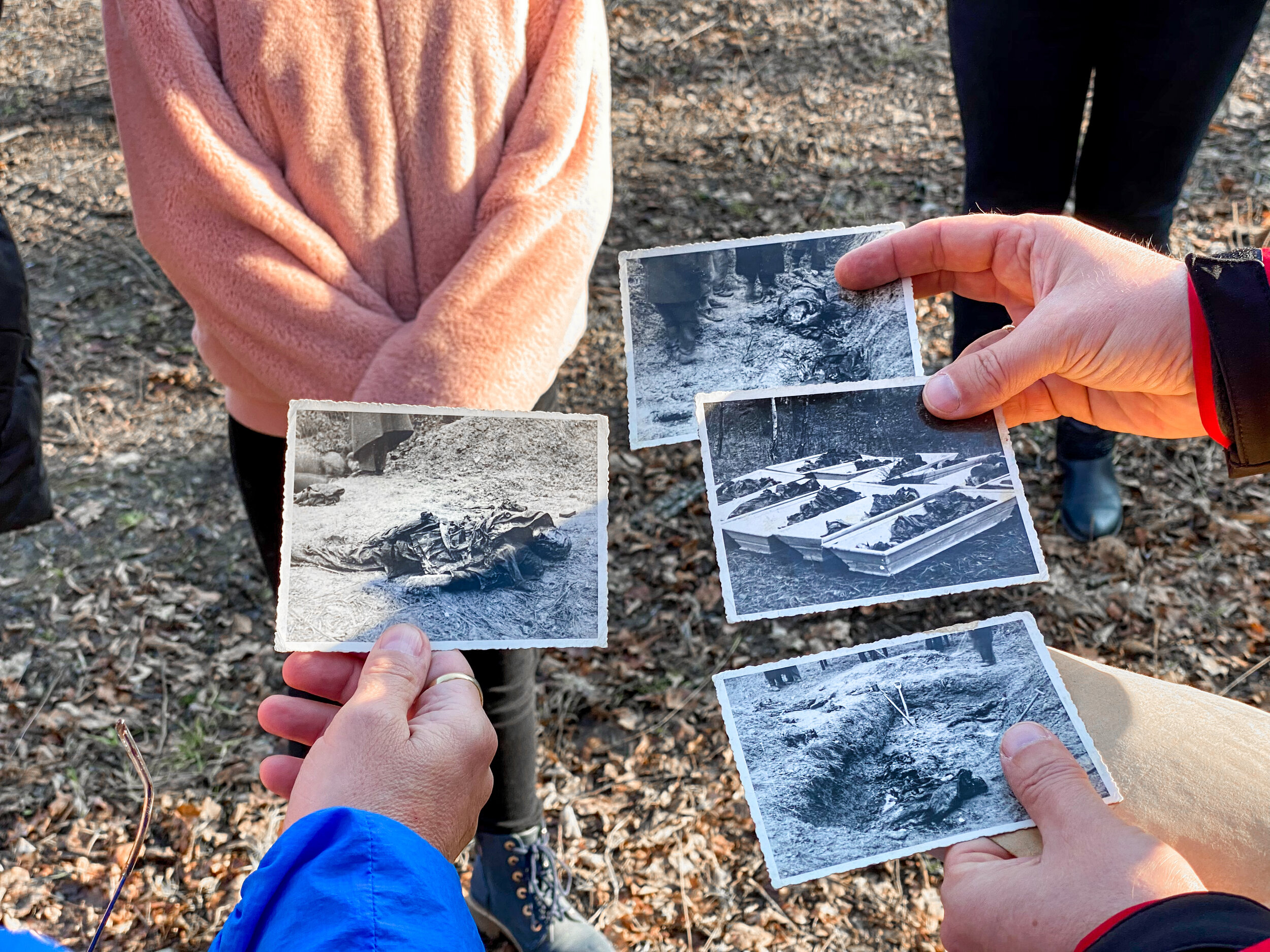 Walk of Remembrance - Polish historian Pawel Szymkowicz shows photos of victims of a Nazi mass execution along the Death March route near Ilawa, Poland. The photos were taken by a Polish war crimes investigation in 1946. Thousands of prisoners died