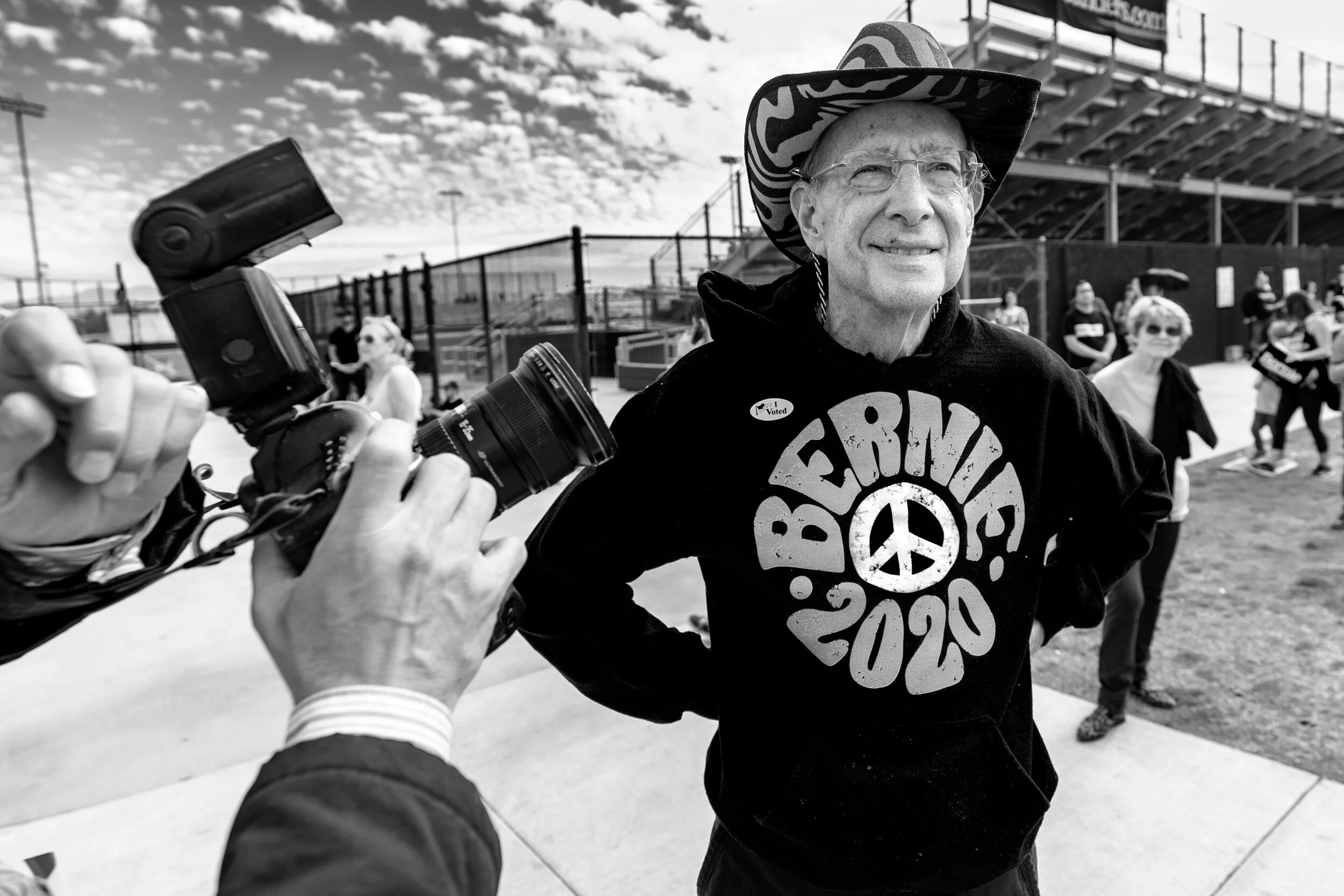 A press photographer takes a picture of a supporter of Democratic presidential candidate Sen. Bernie Sanders during a campaign rally in Santa Ana, California.