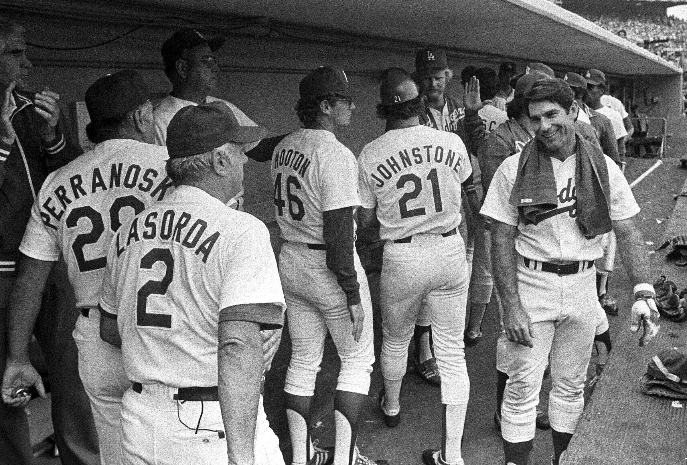  LOS ANGELES, CA - 1981: Manager Tommy Lasorda #2, Ron Perranoski #29, Burt Hooton #46, Jay Johnstone #21 and Steve Garvey #6   of the Los Angeles Dodgers in the dugout during the 1981 NLCS playoffs1981 at Dodger Stadium, Los Angeles, California. (Ph