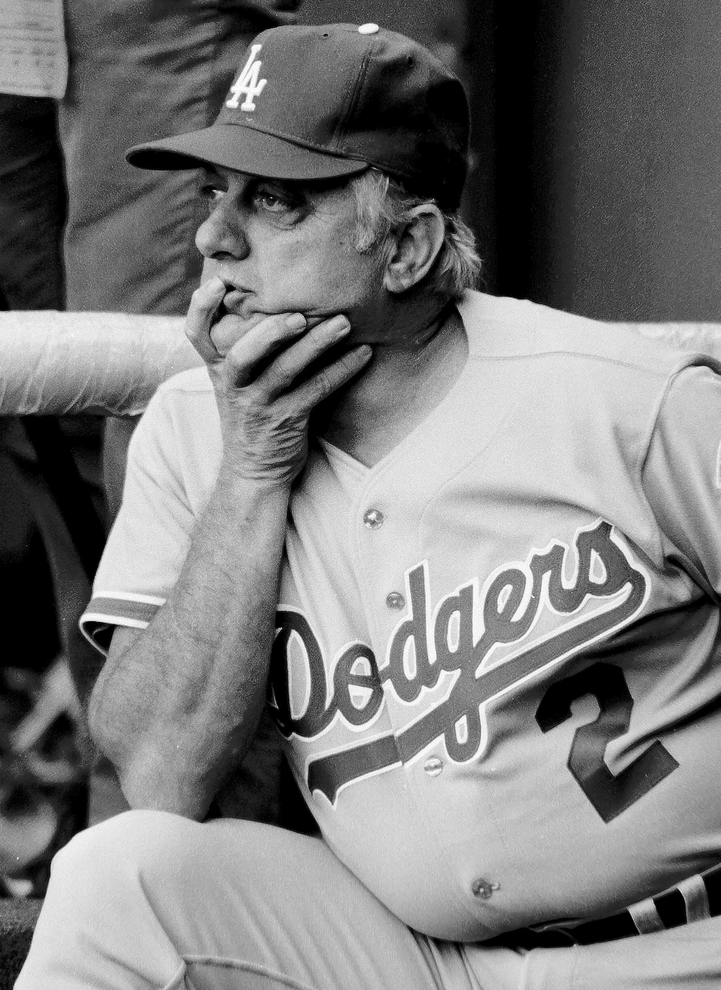  LOS ANGELES, CA - 1981:  Tommy Lasorda #2, manager of the Los Angeles Dodgers, sits in the dugout during a game at Dodger Stadium, Los Angeles, California. (Photo by Jayne Kamin-Oncea/Getty Images) 