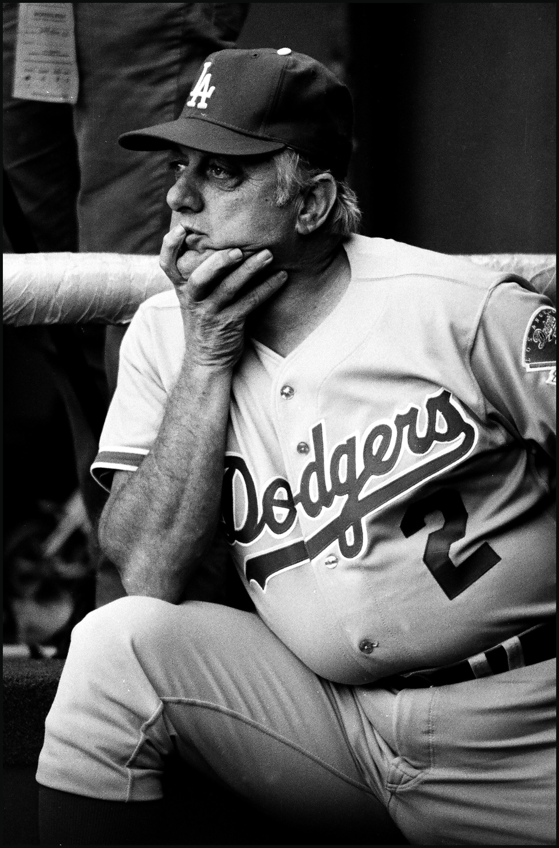  LOS ANGELES, CA - 1983: Manager Tommy Lasorda #2 of the Los Angeles Dodgers looks on from the dugout during a game at Dodger Stadium, Los Angeles, California. (Photo by Jayne Kamin-Oncea/Getty Images) 