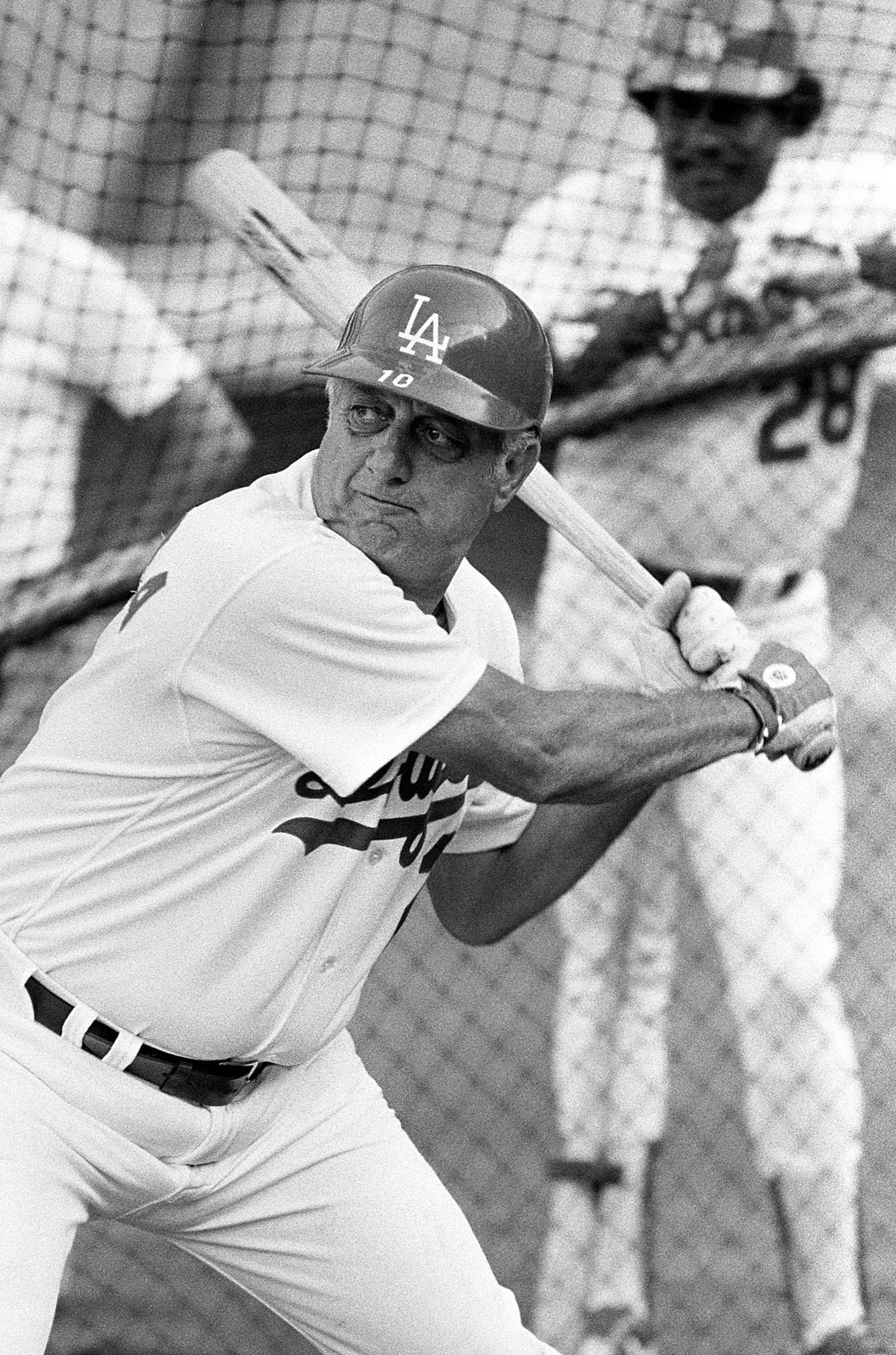  1989 Los Angeles, CA; USA;  FILE PHOTO Los Angeles Dodgers manager Tommy Lasorda (2) takes batting practice before a game at Dodger Stadium. Los Angeles Dodgers Pedro Guerrero (28) in background. Mandatory Credit: Jayne Kamin-Oncea-US PRESSWIRE 