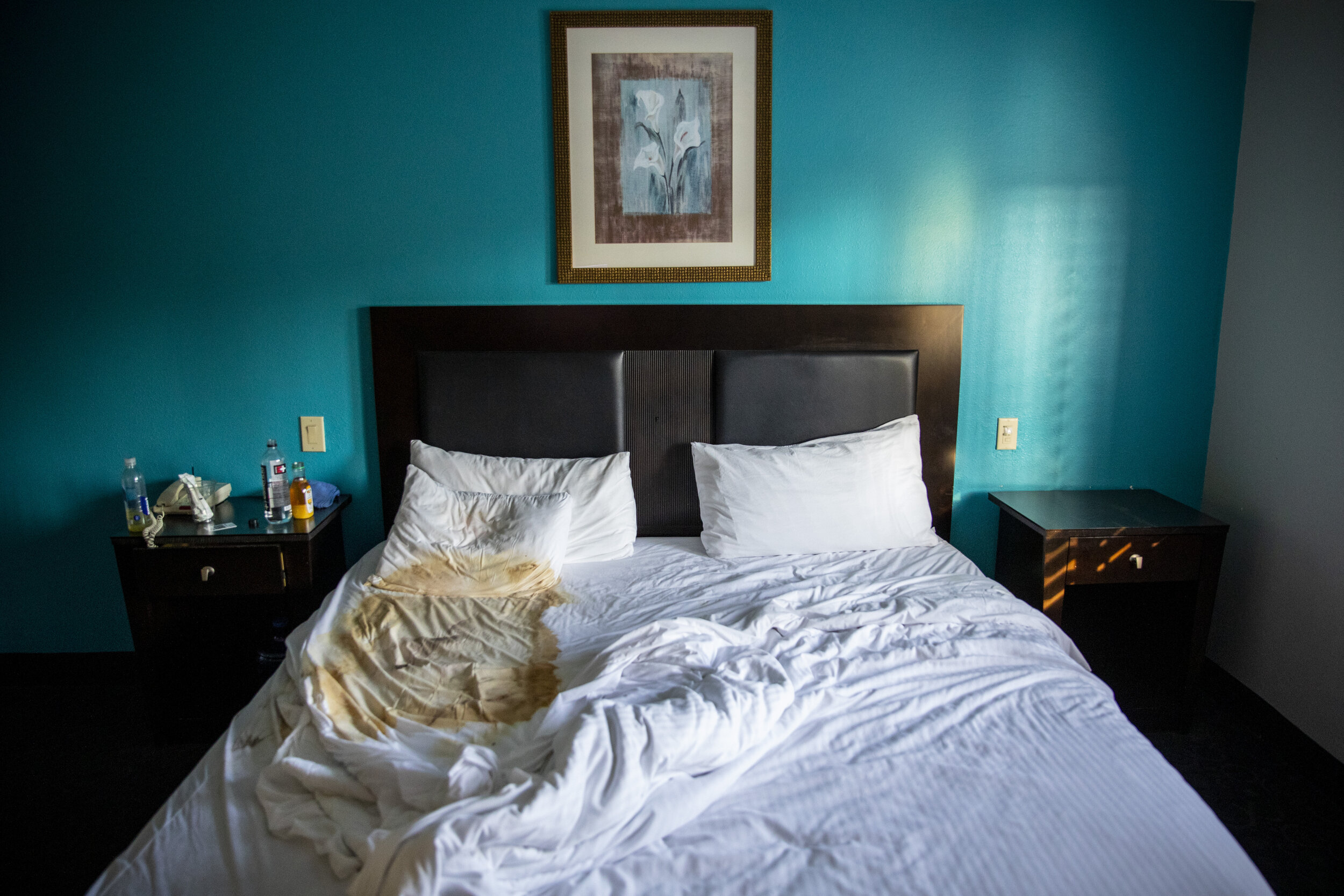  The empty, stained bed, where the lifeless body of Judy Bounthong, 58, an ob-gyn tech at Emanate Queen of the Valley Hospital was found by Los Angeles County Dept. of Medical Examiner-Coroner workers, at the Days Inn by Wyndham, in West Covina, CA, 