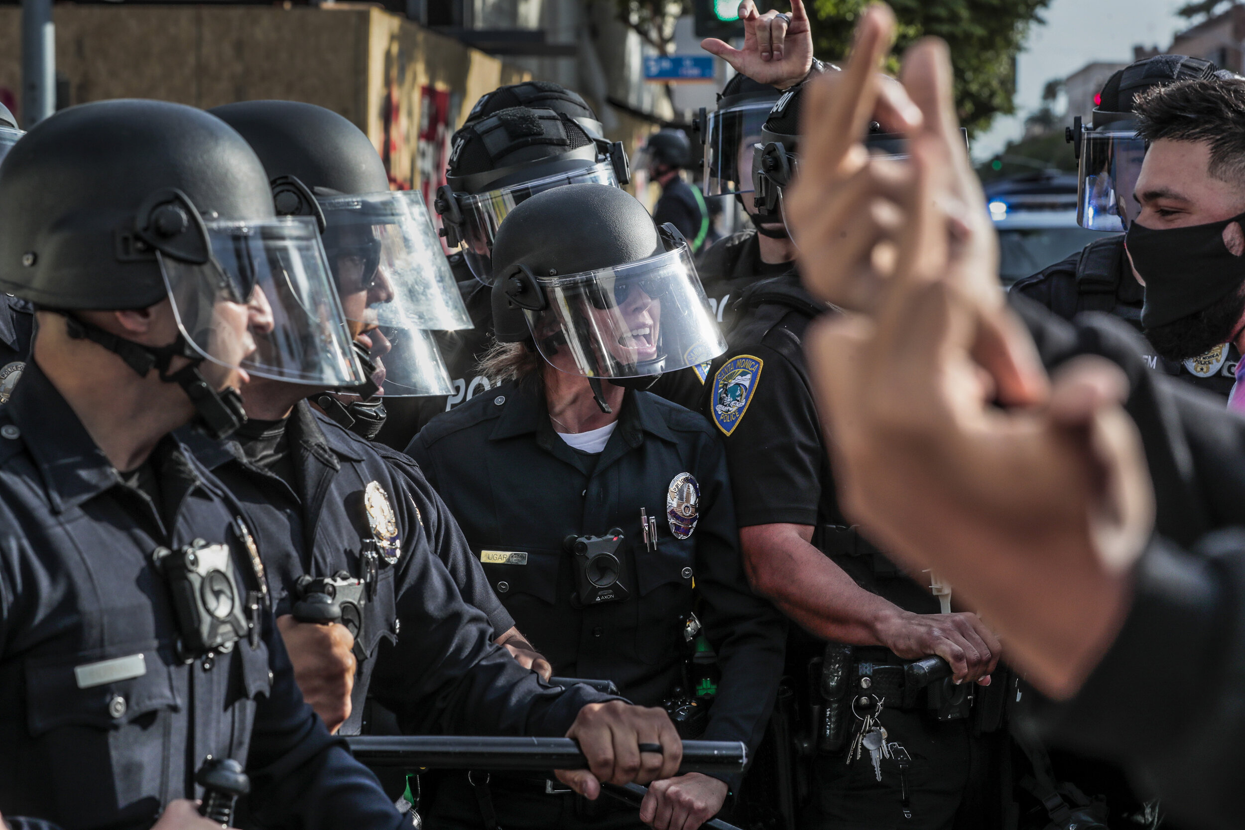  Los Angeles police officer Mayra Ugarte screams at protesters to move back as she and fellow officers attempt to restore order after Santa Monica businesses were vandalized and looted as unrest continues in the wake of the death of George Floyd. Acc