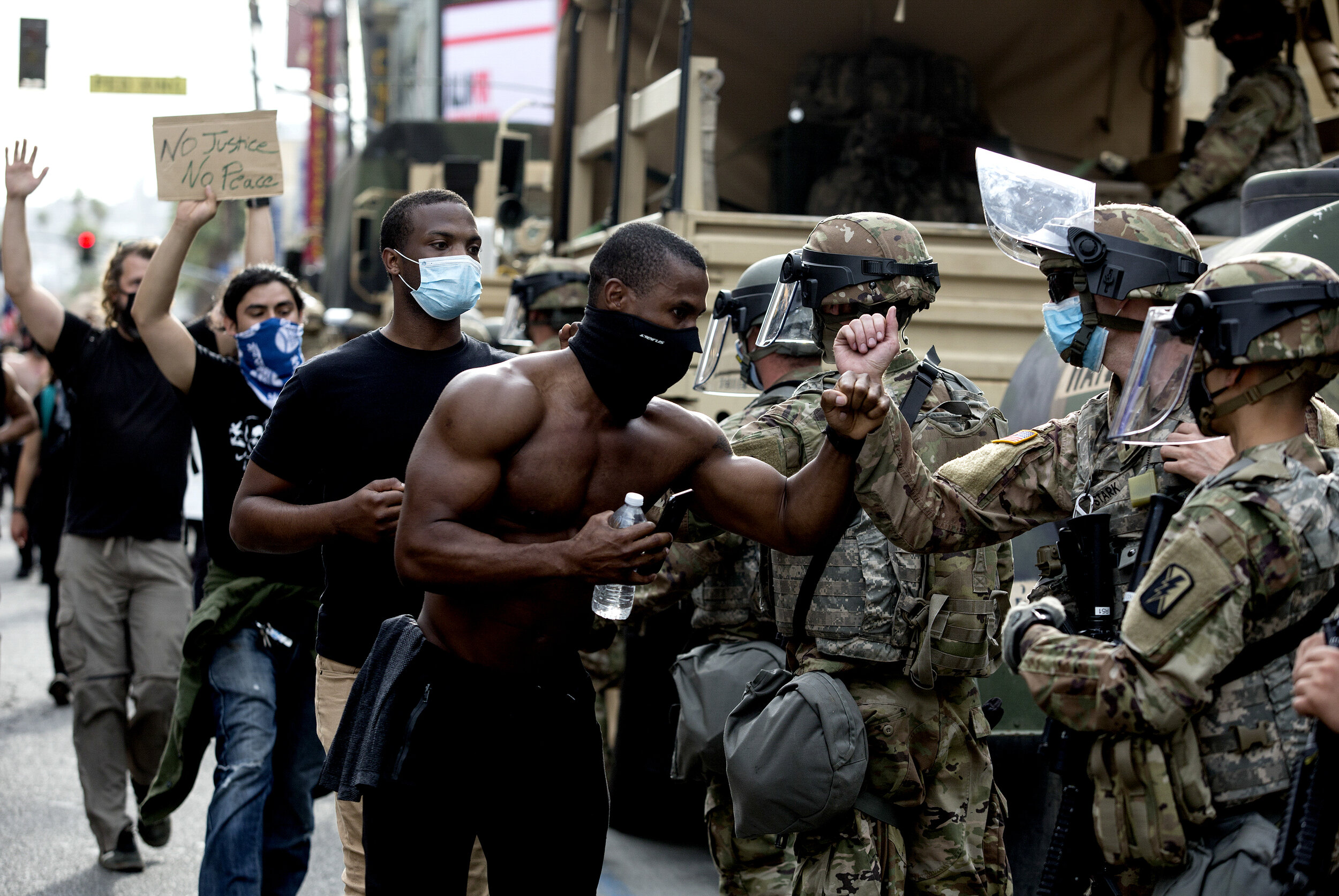  Demonstrators greet members of the National Guard as they march along Hollywood Boulevard during a protest over the death of George Floyd who died May 25 after he was restrained by Minneapolis police, Tuesday, June 2, 2020, in the Hollywood section 