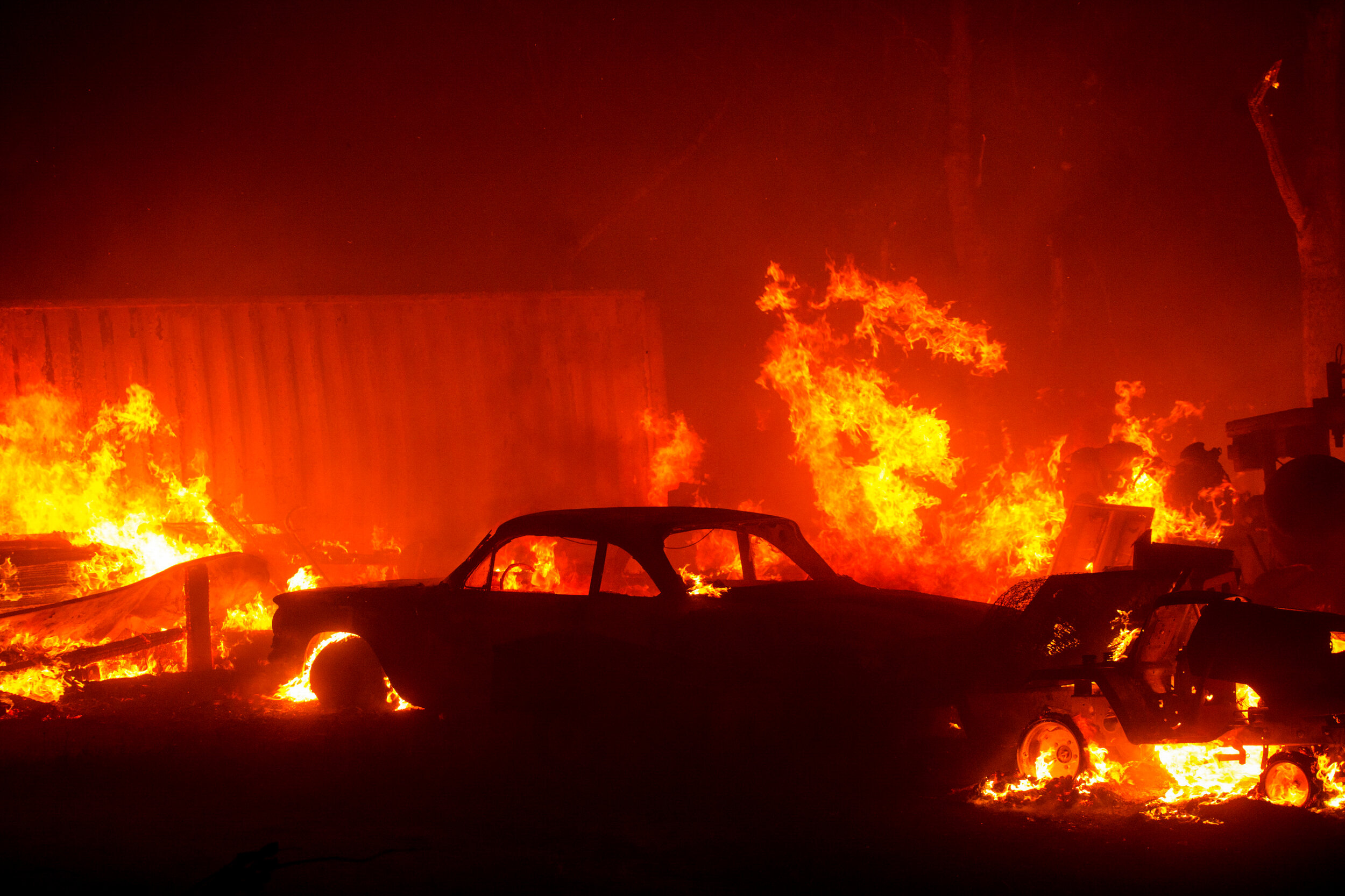  The Lake Fire burns a vehicle near Lake Hughes  in the Angeles National Forest on Wednesday, Aug. 12, 2020, north of Los Angeles. The 2020 California wildfire season was characterized by a record-setting year of wildfires that burned across the stat